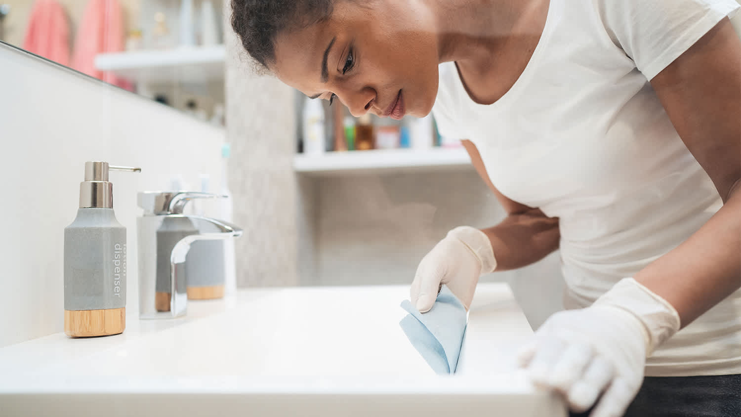 Woman cleaning her blue bathroom