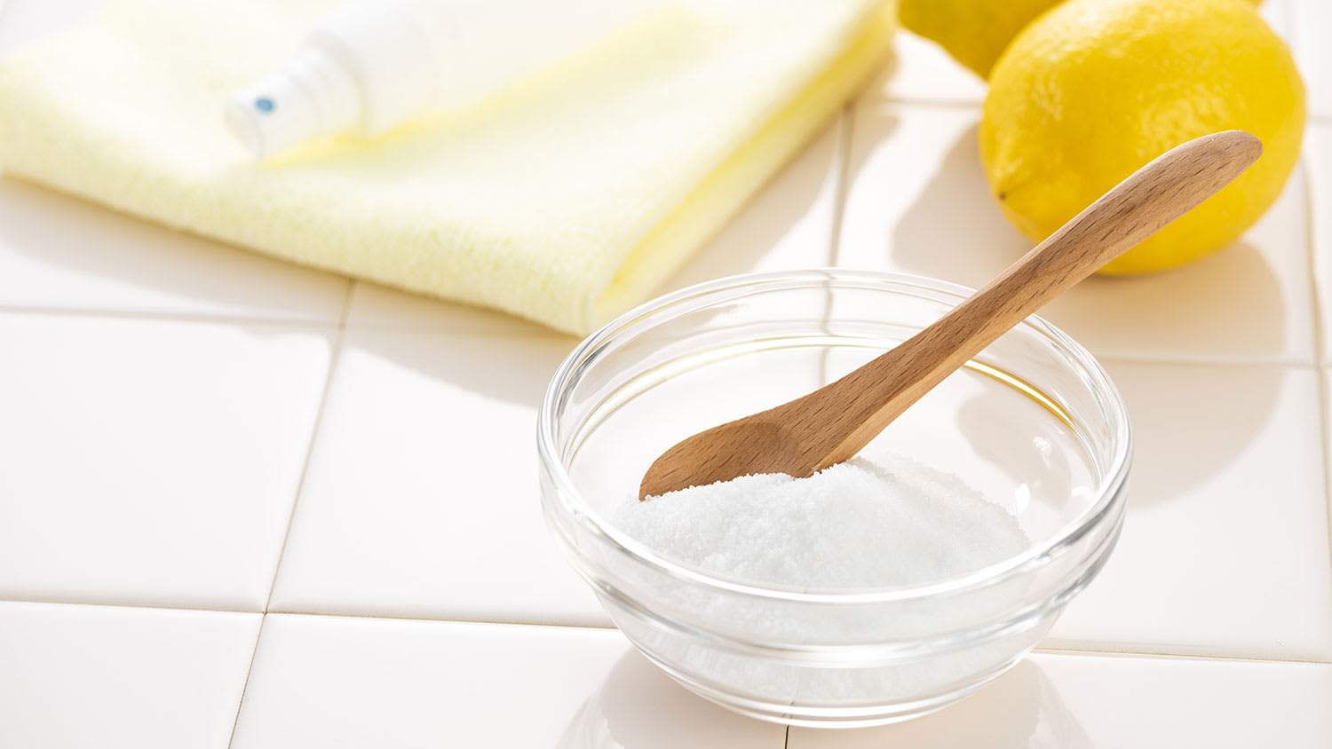 Baking soda and lemons on a kitchen counter