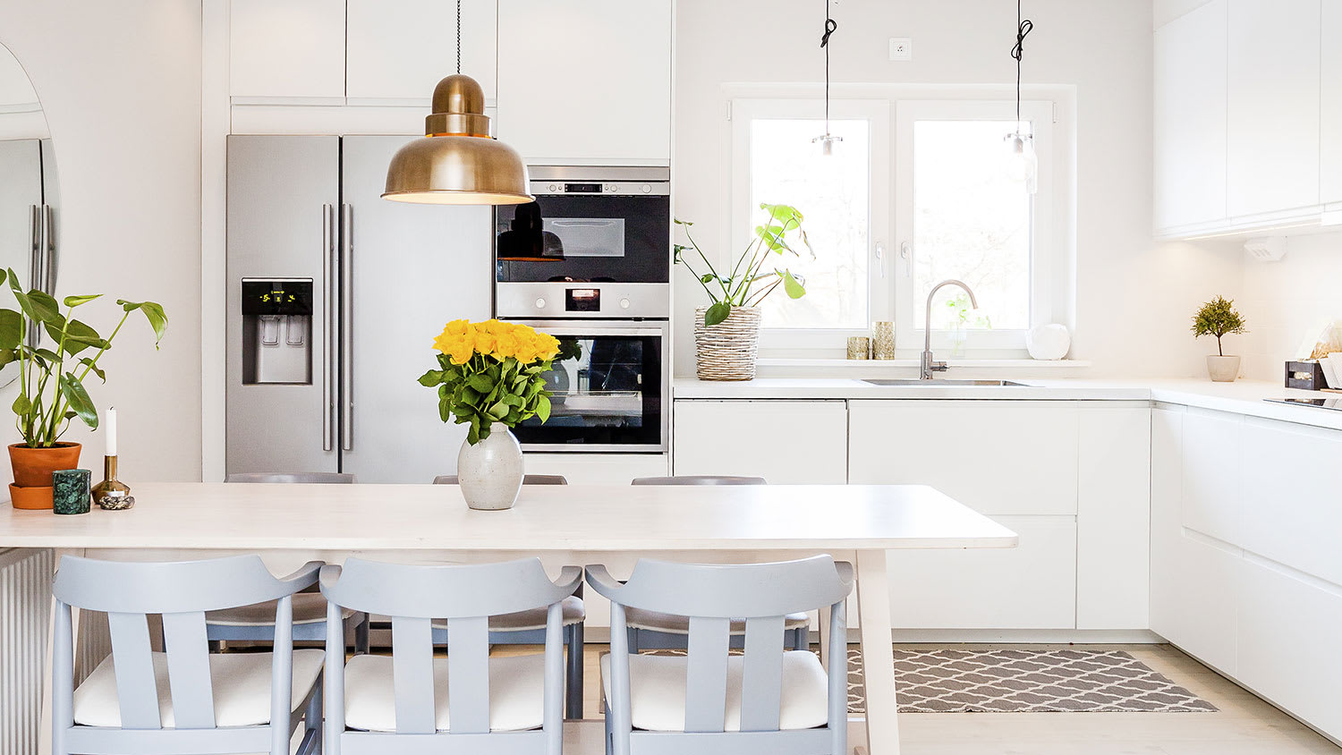 Bright kitchen with rectangular table and chairs