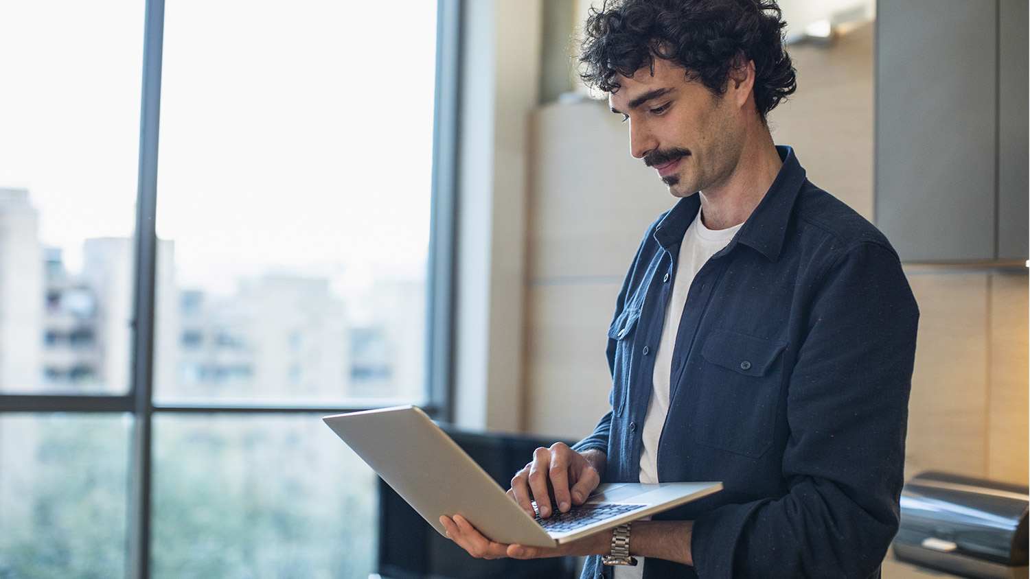 Man smiling laptop office