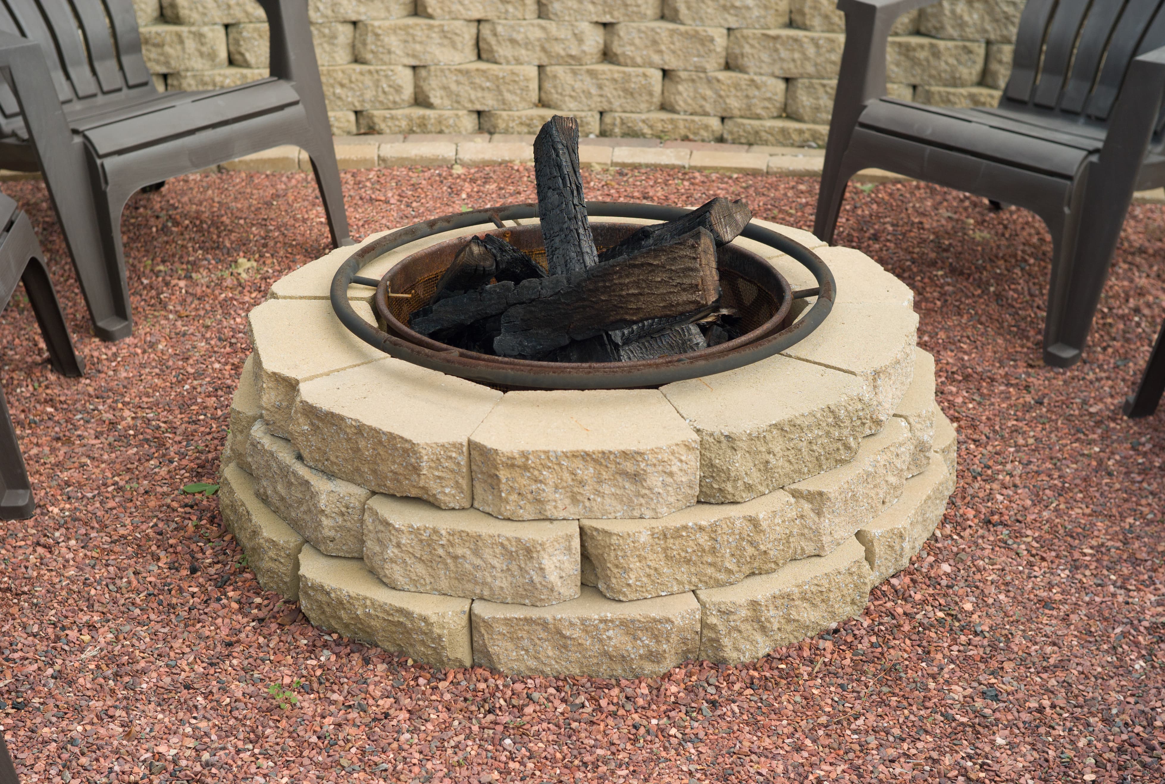 A round fire pit made with stone pavers