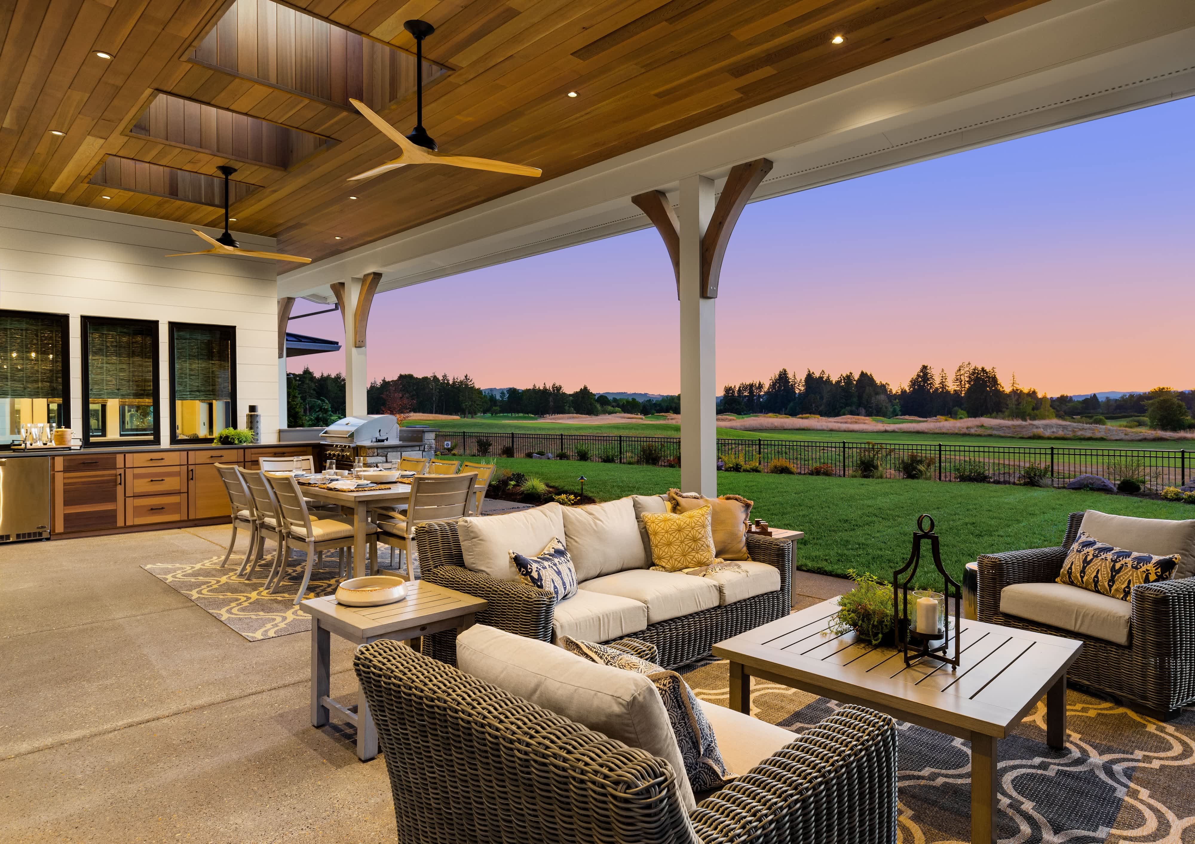 Outdoor living and dining area with outdoor ceiling fans