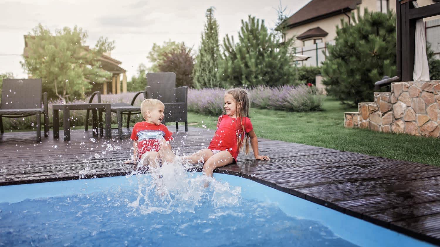 boy and girl playing in the pool