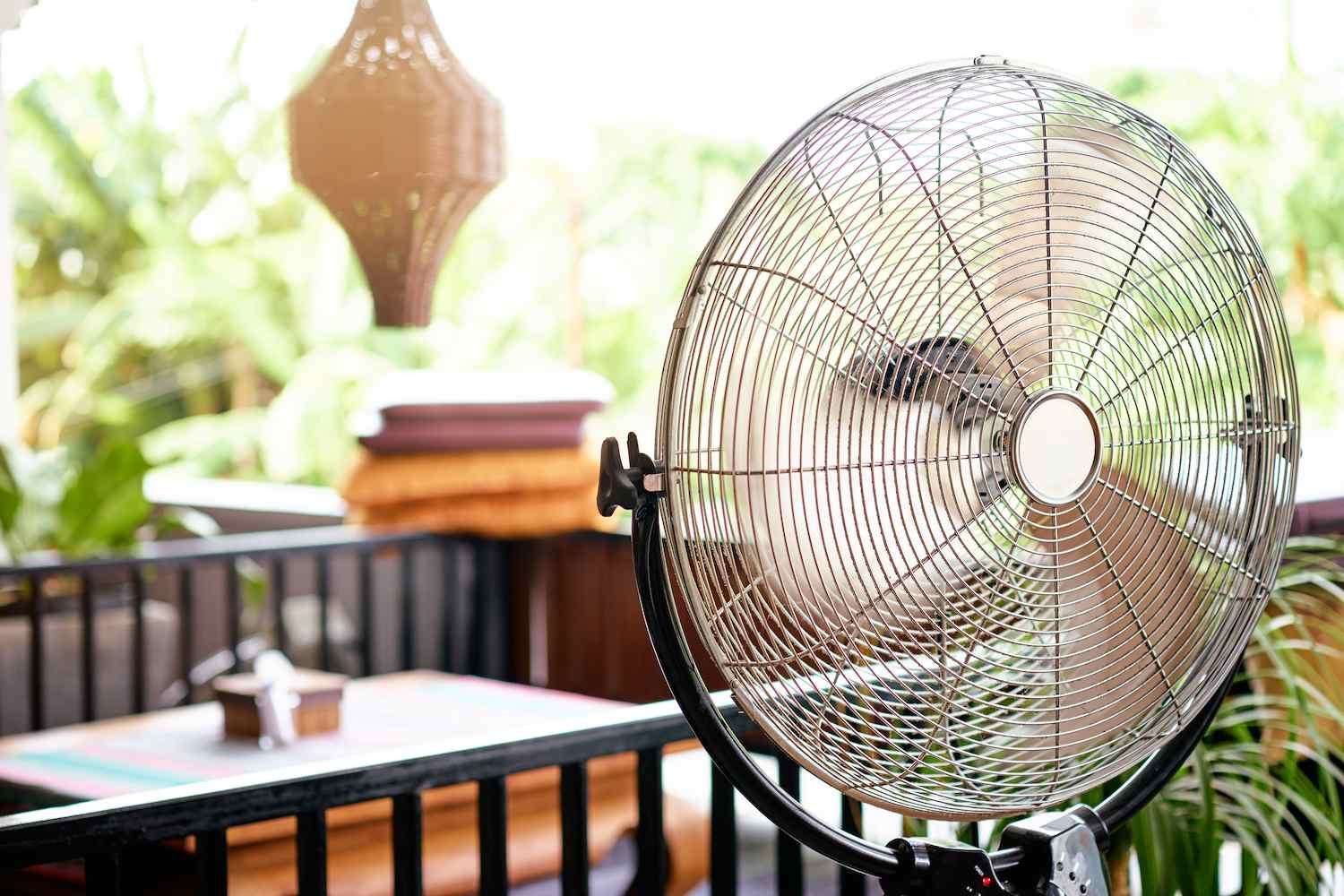 Electric fan cooling air on a patio
