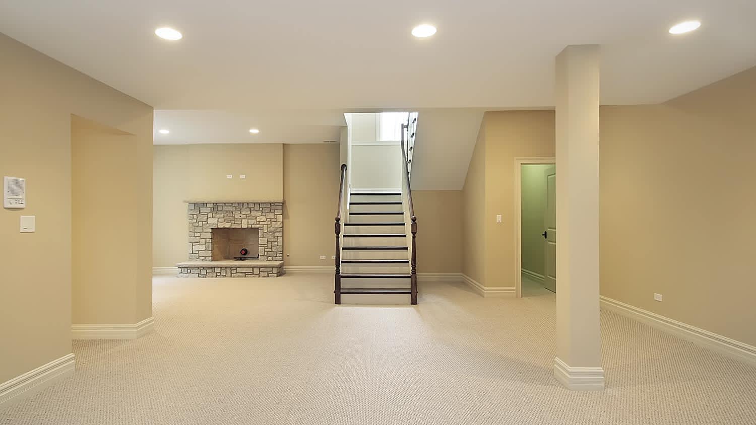 Basement with stone fireplace