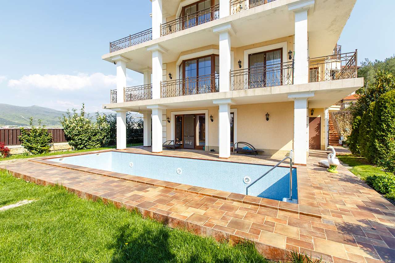 backyard with large empty pool