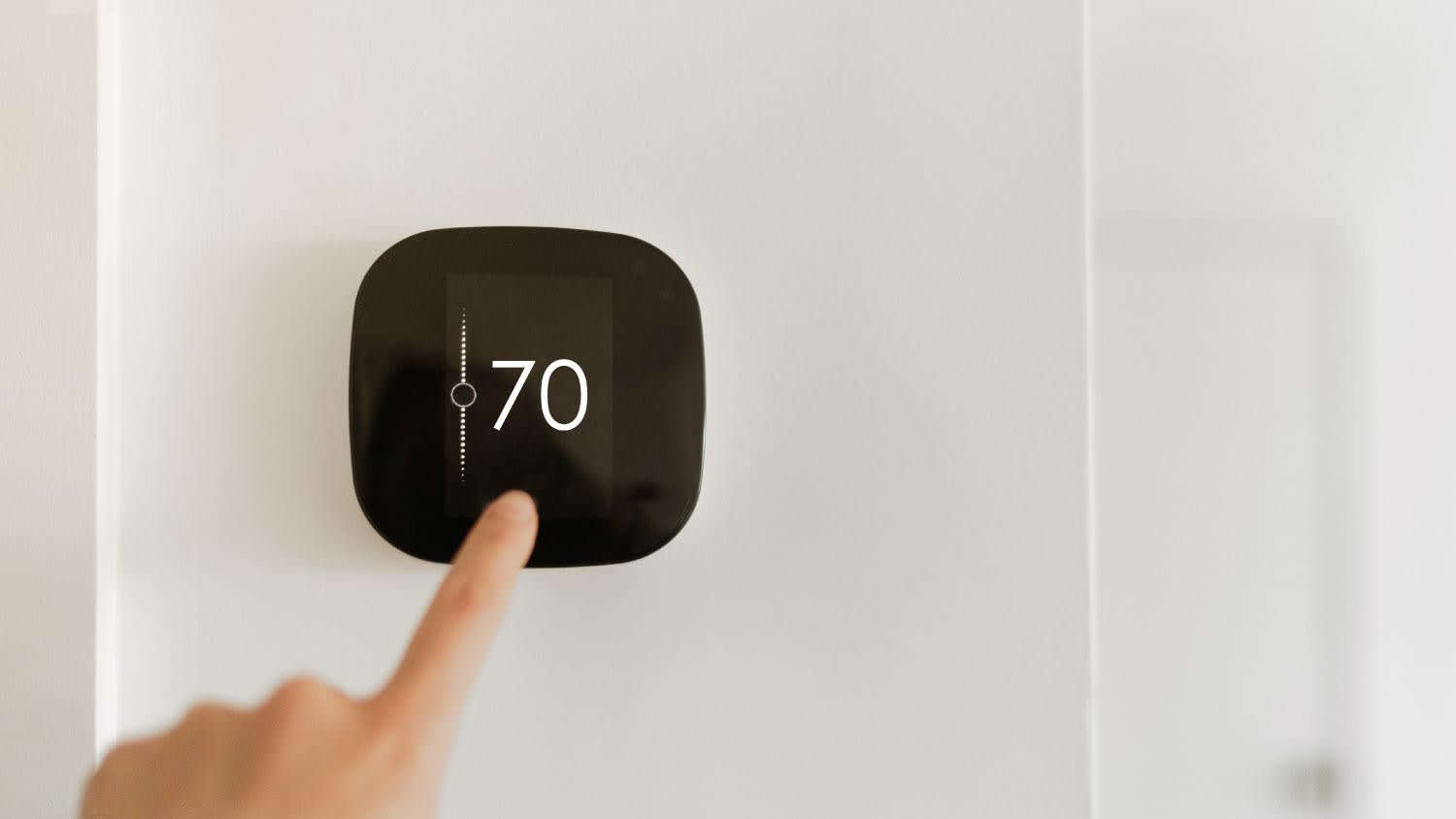A black smart thermostats