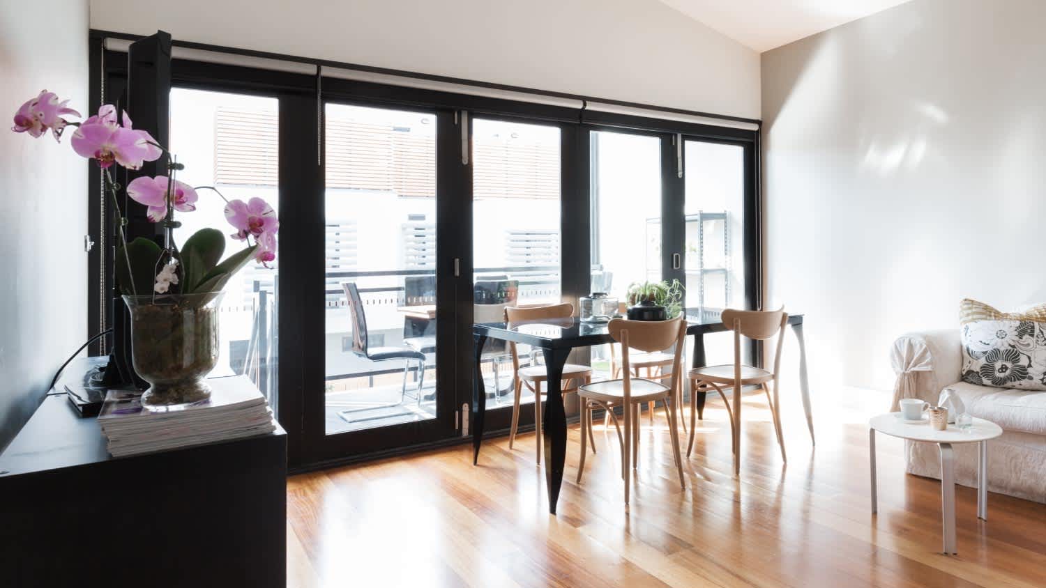 An apartment living room with bifold doors