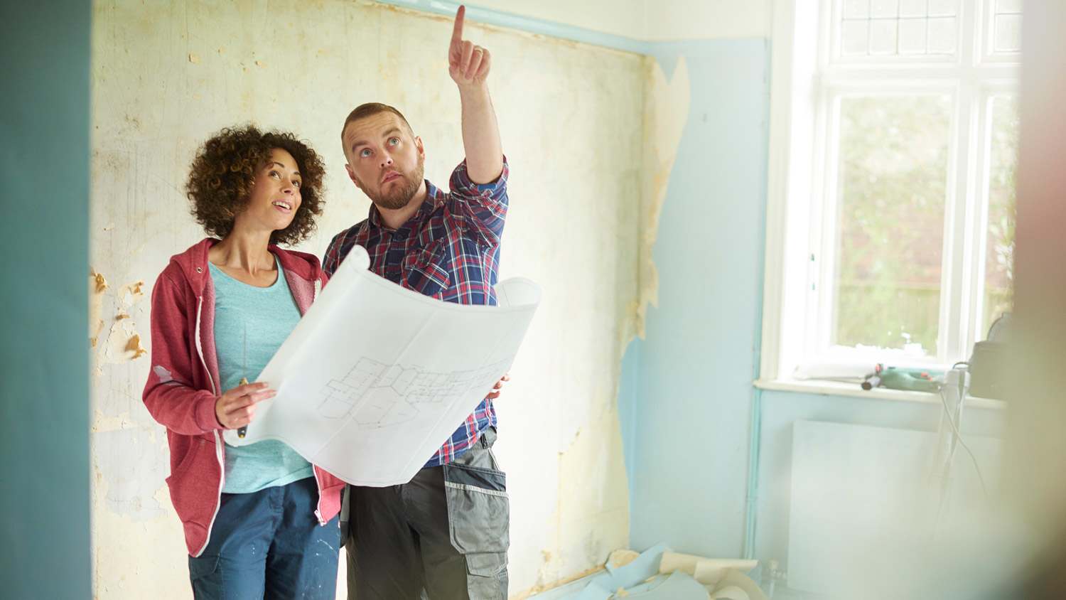 An owner and a contractor talking about the house’s renovation