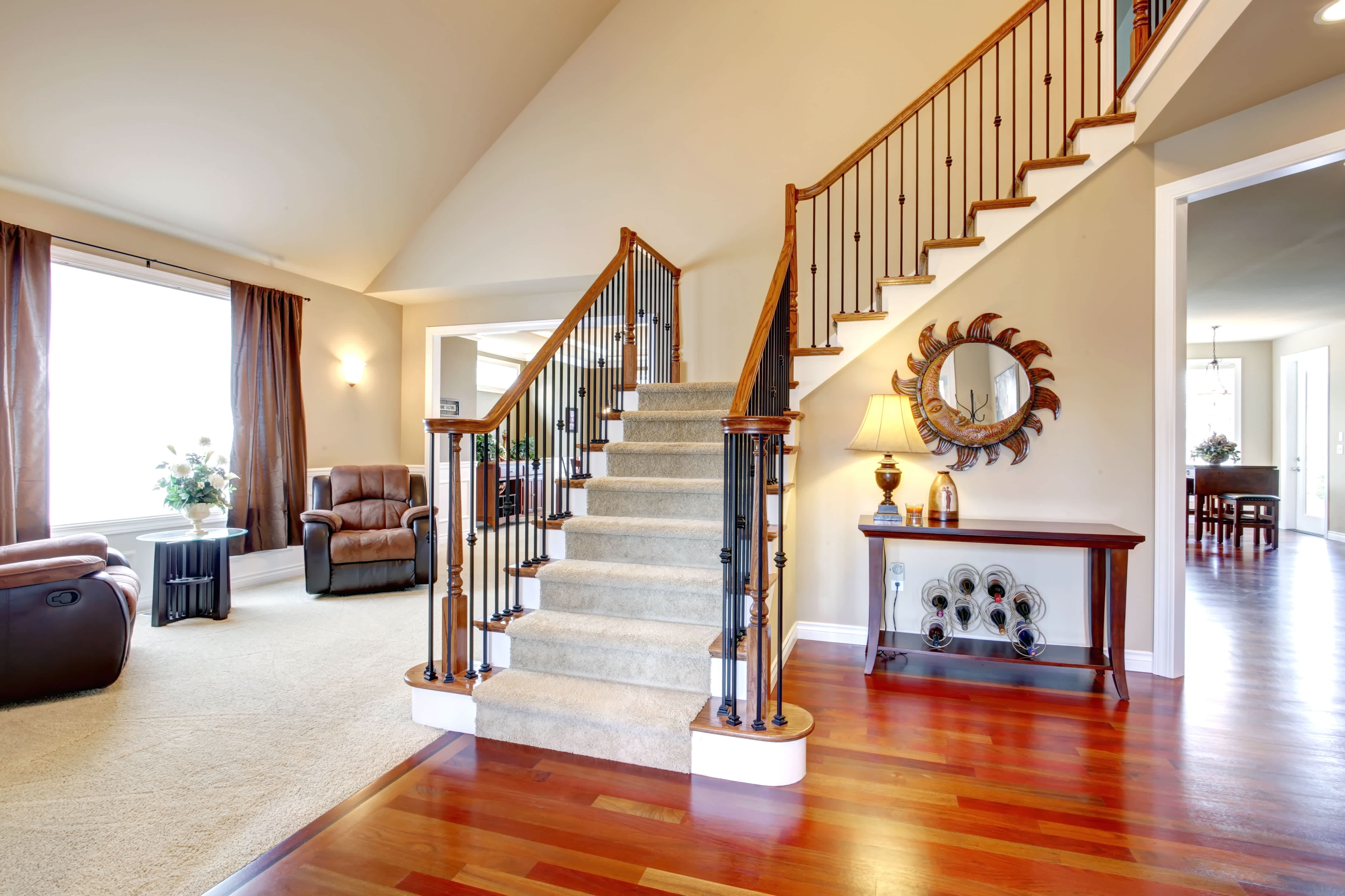 An interior staircase with a carpet runner
