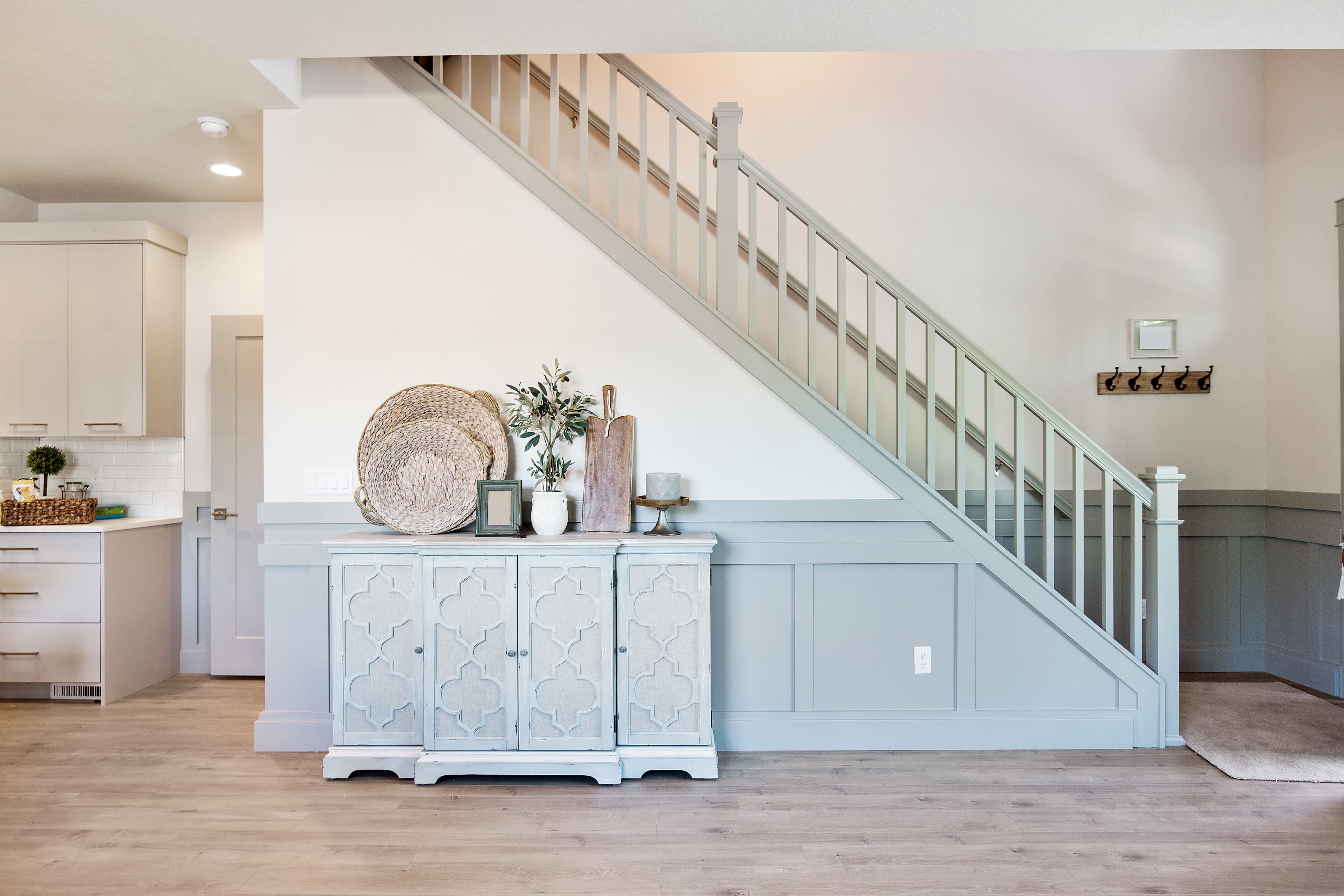 A farmhouse decorative table on an interior stairwell wall