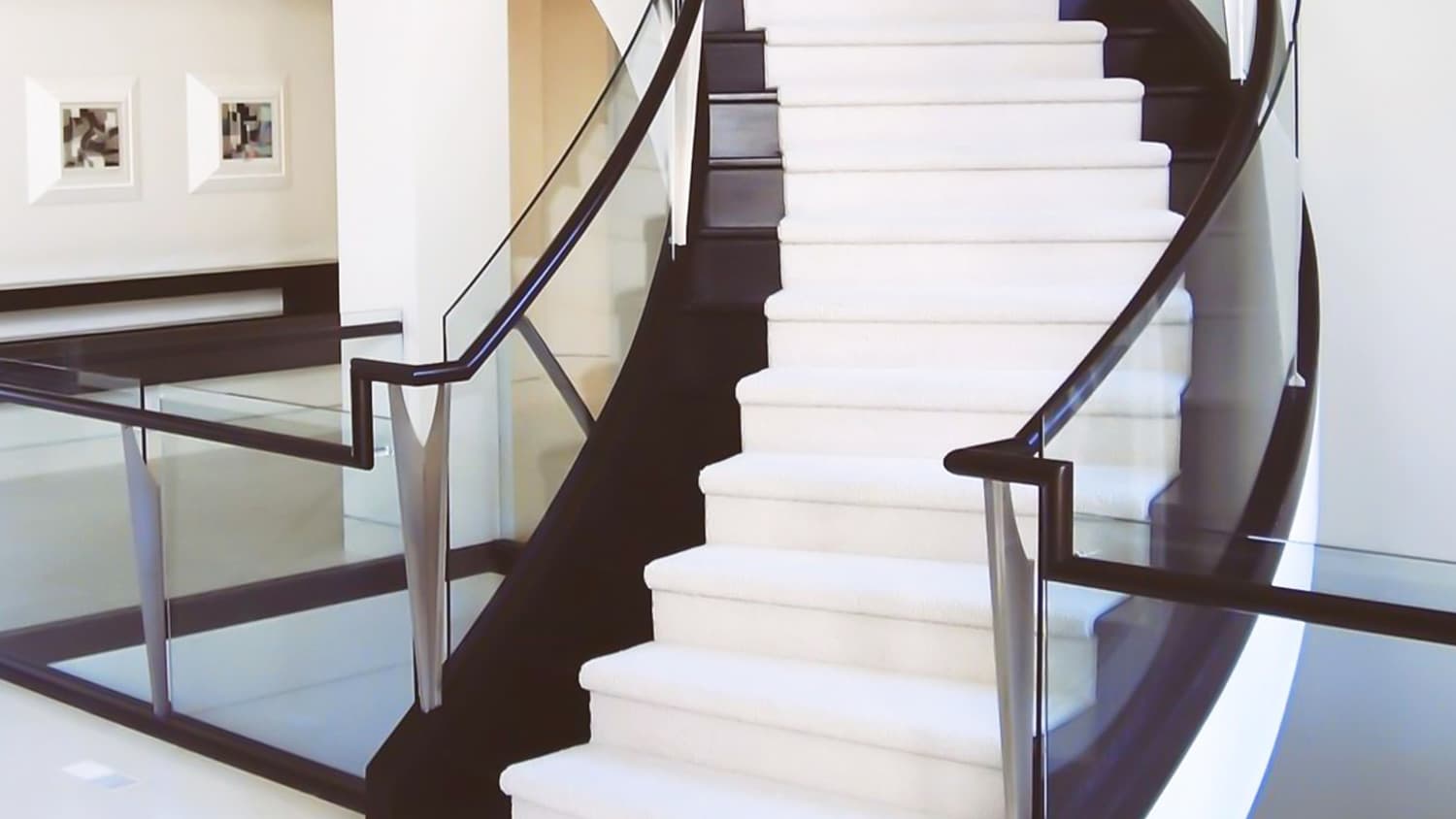 Black stairs white carpet modern
