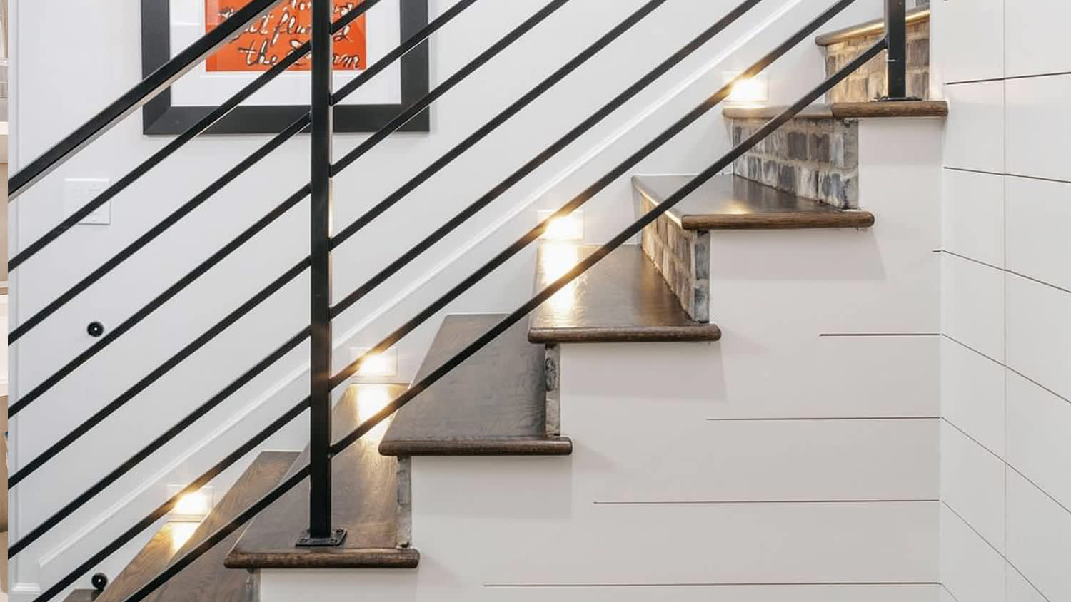 White stairs black railings lights