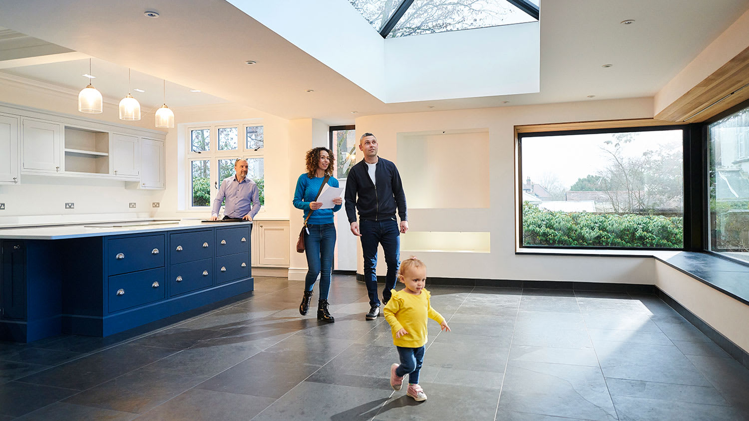 Family looking at house