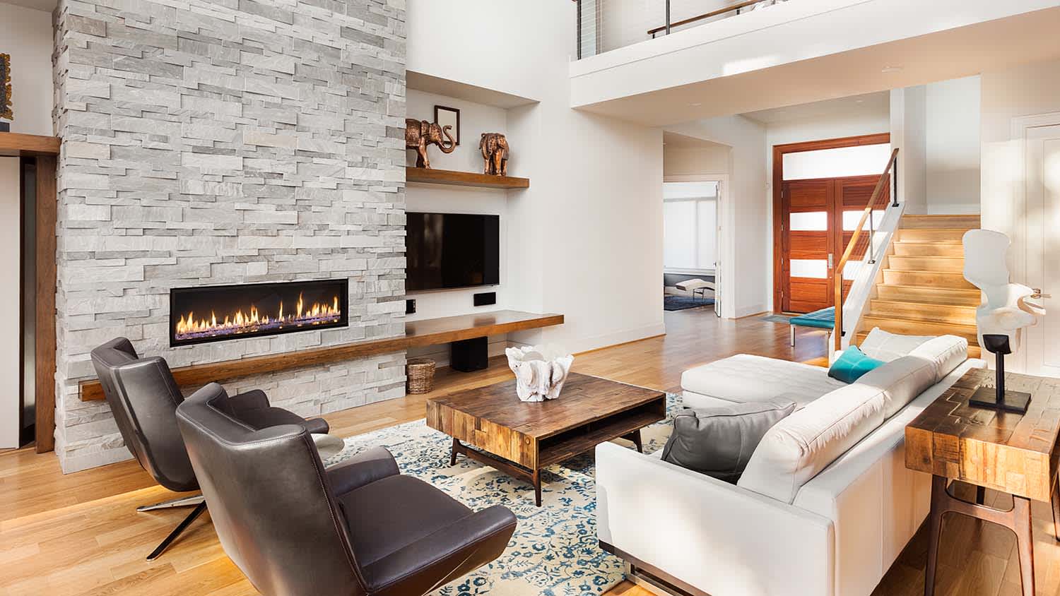 living room with linear style fireplace