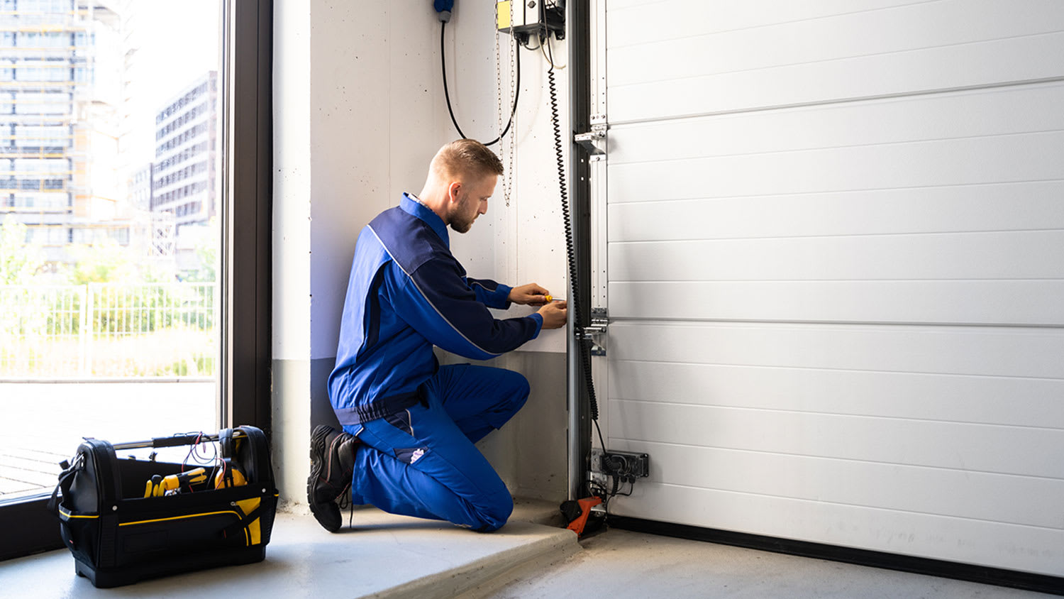 Man repairing garage door