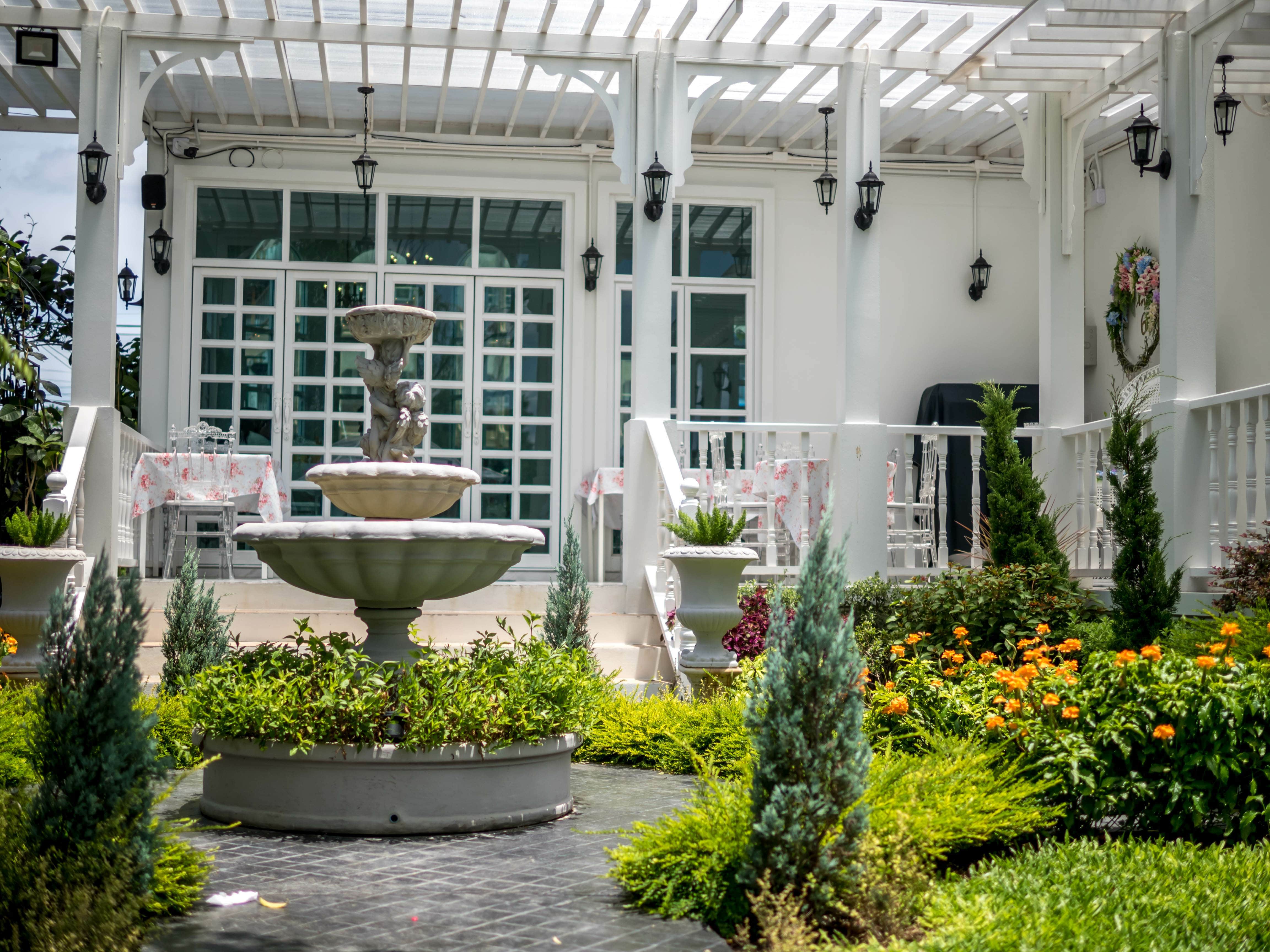 Backyard patio with a white water fountain