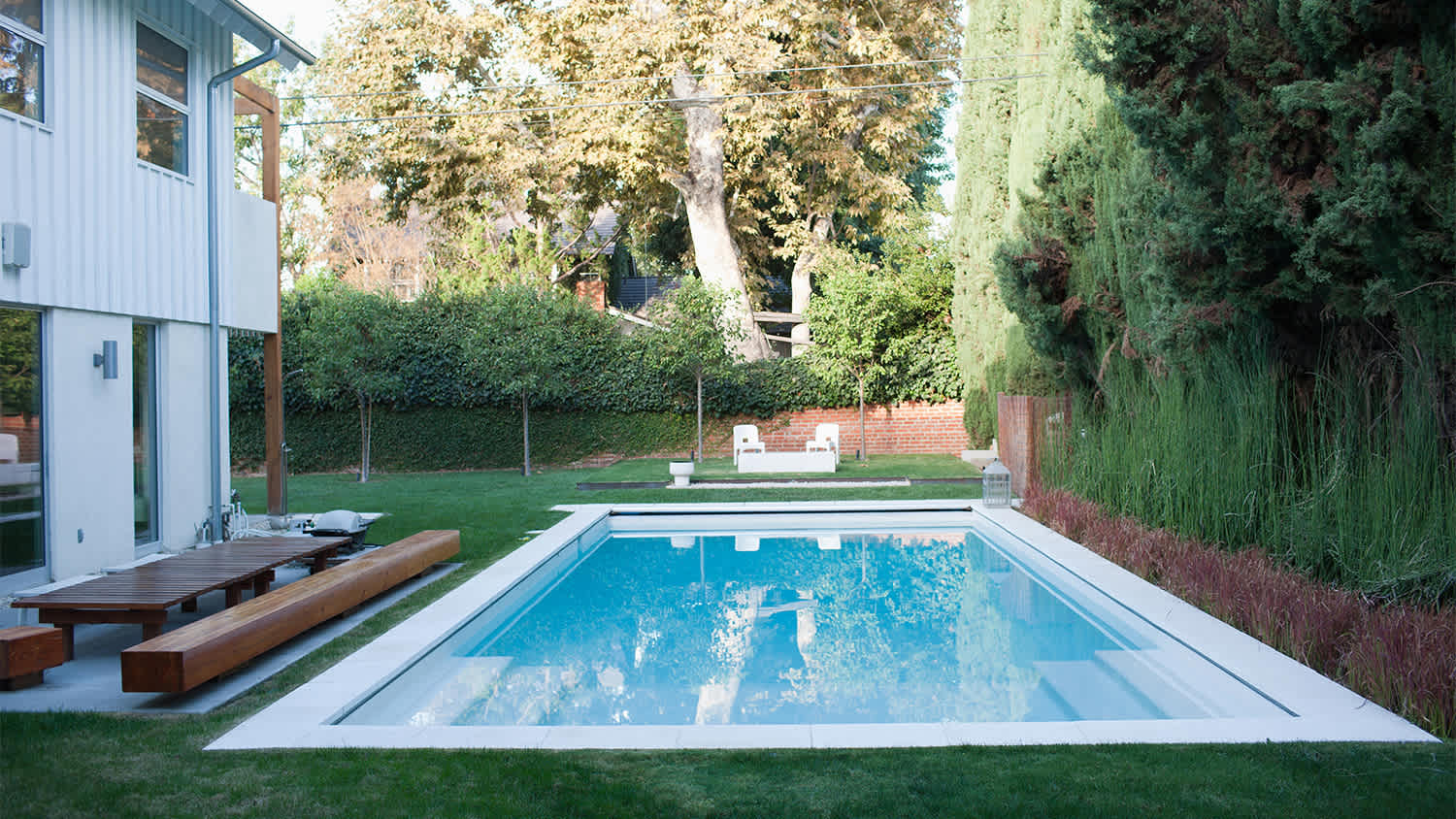 swimming pool in a large yard