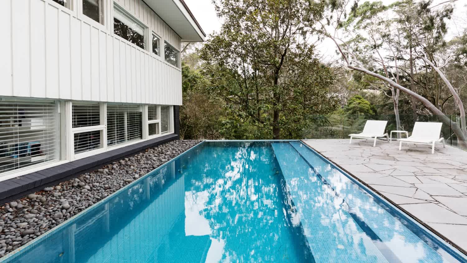 An Infinity edge pool in backyard