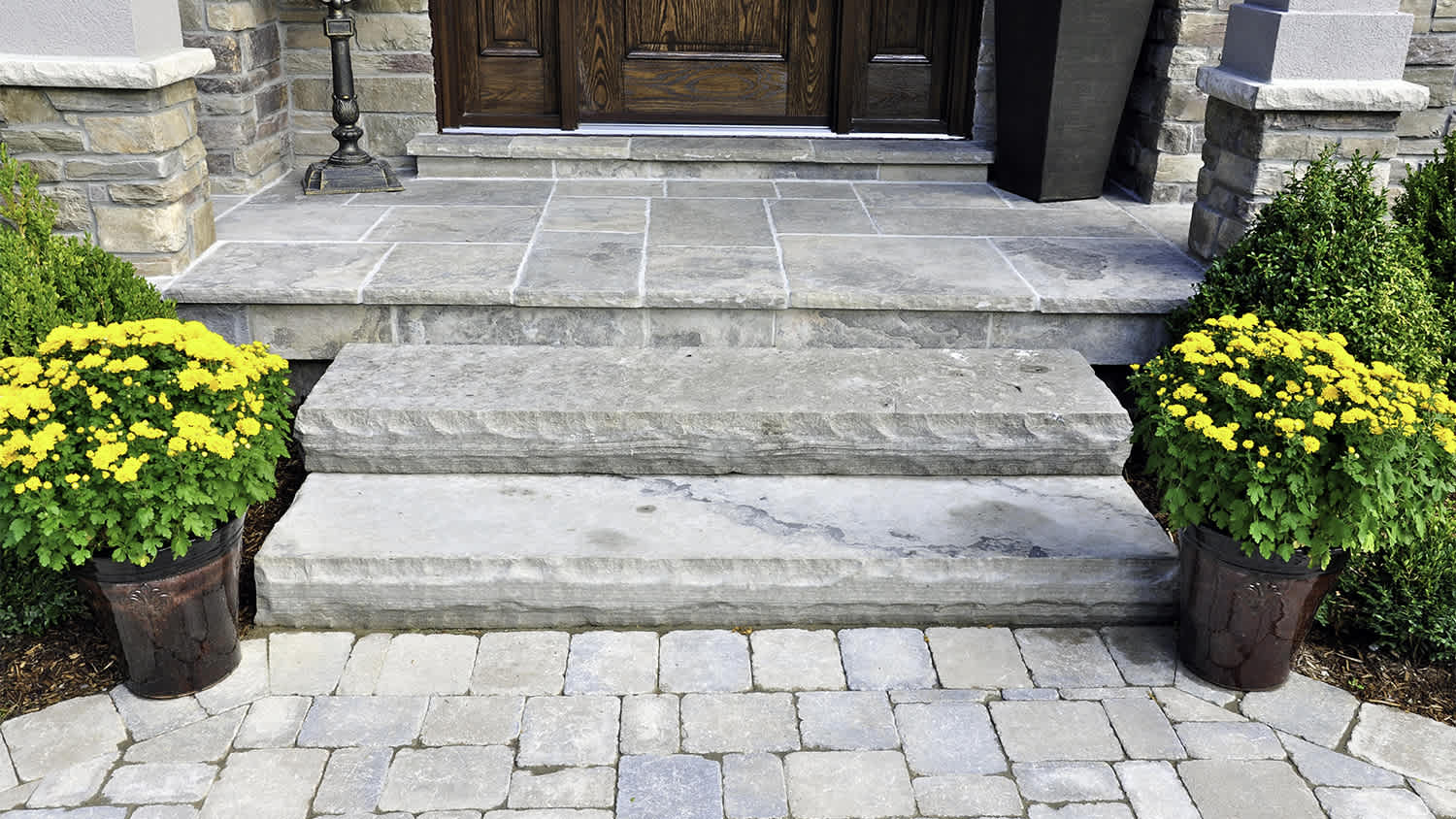concrete stone steps and paver walkway