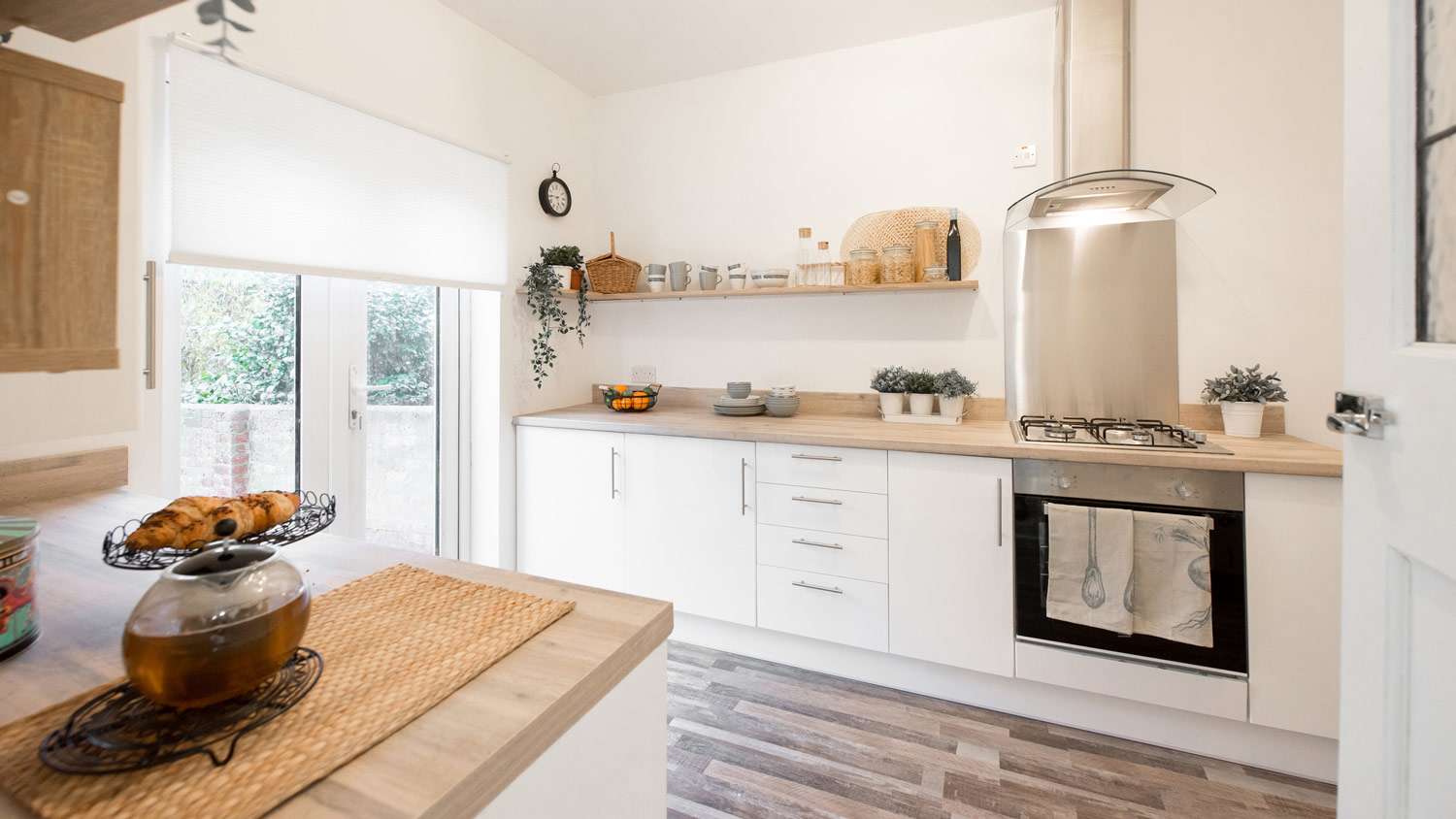 A bright and spacious all white kitchen
