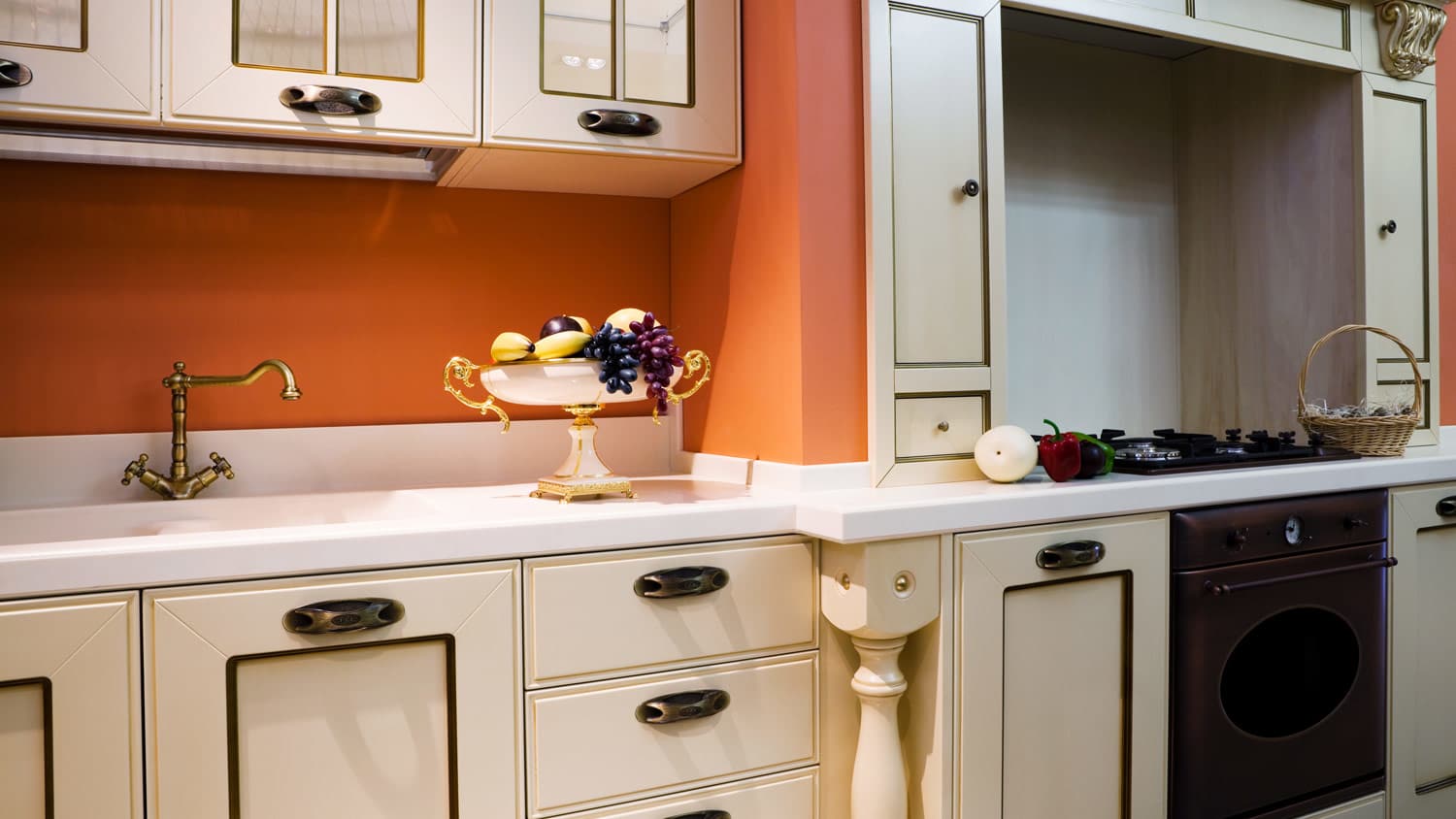 A traditional kitchen with orange walls