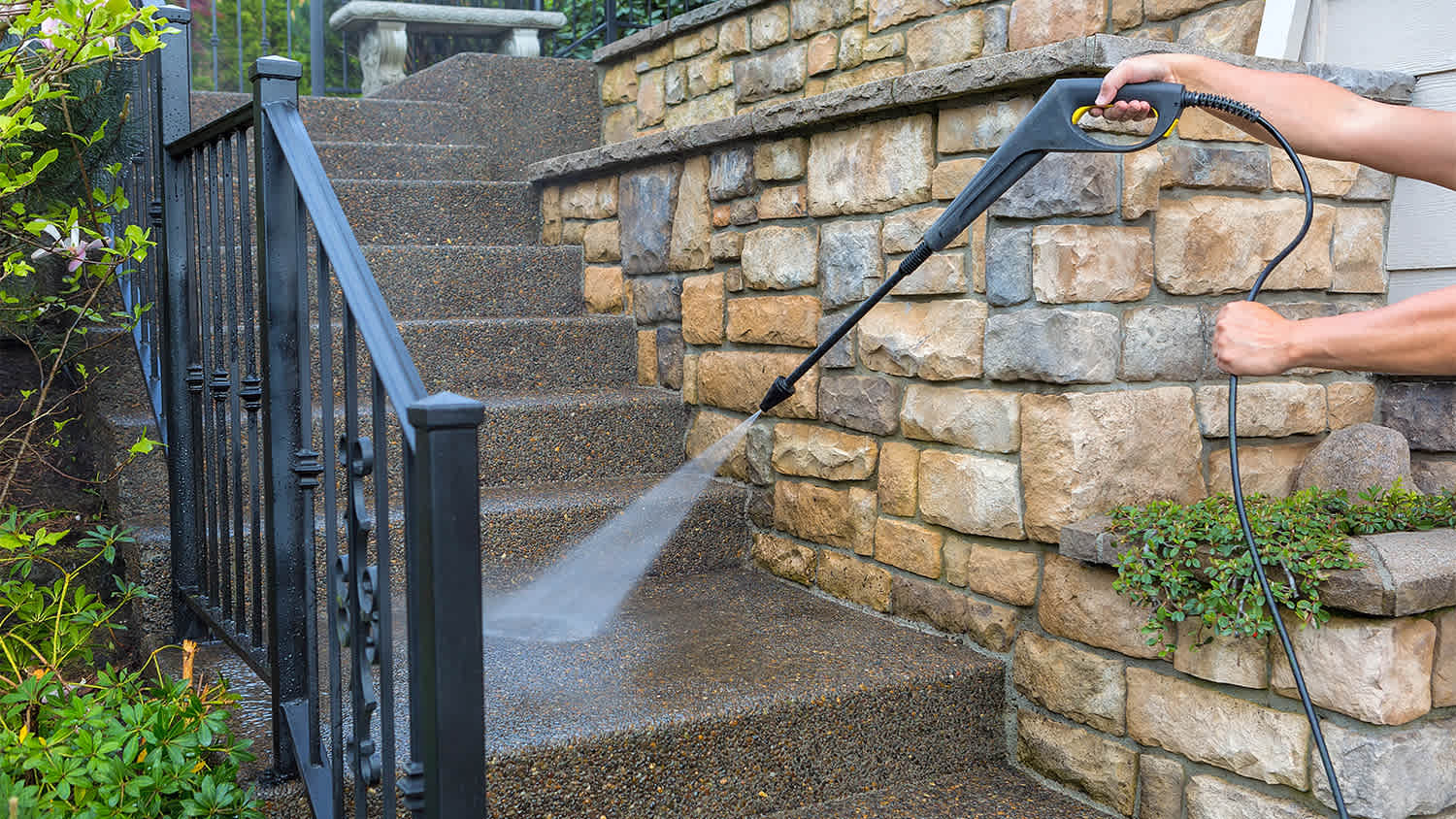 cleaning outside steps with pressure washer