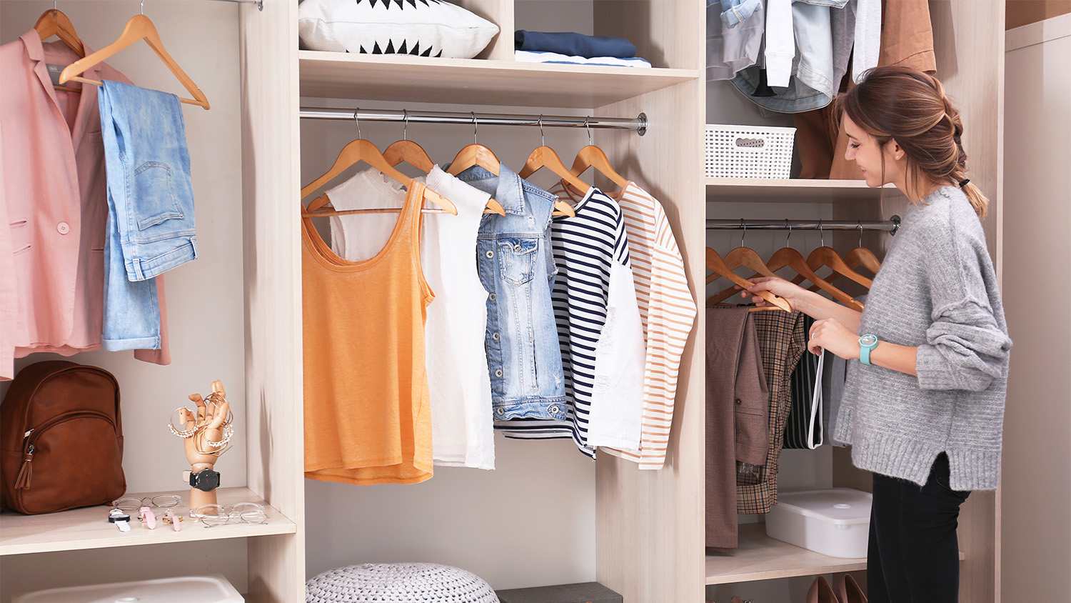 woman looking through wardrobe