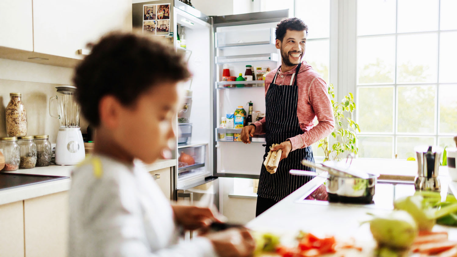 A dad preparing lunch for his son