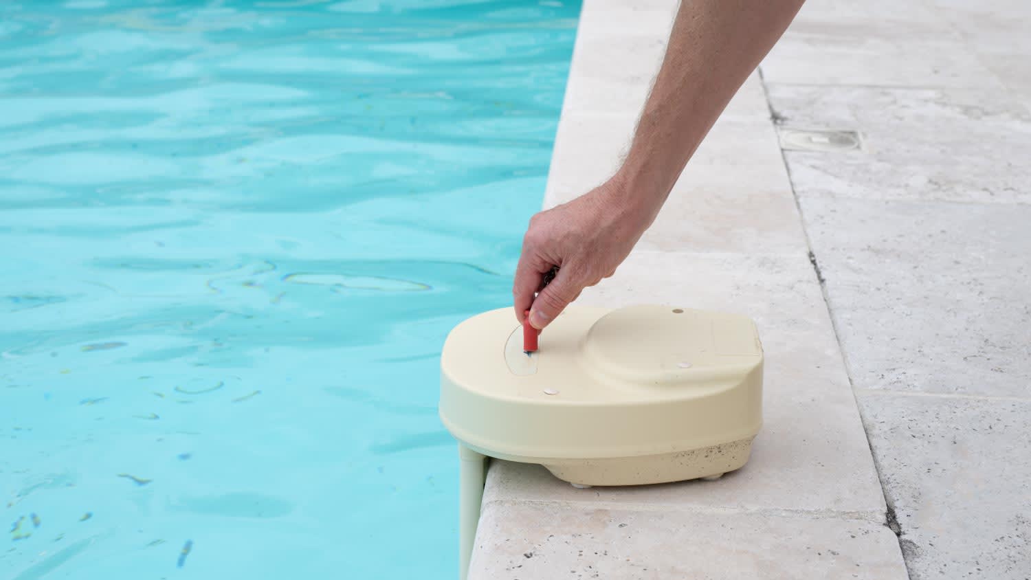 A man activating a  swimming pool alarm