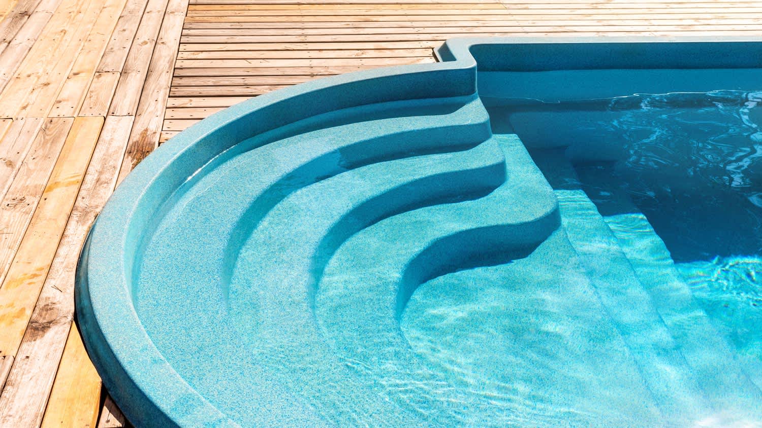 A fiberglass pool and its entrance steps