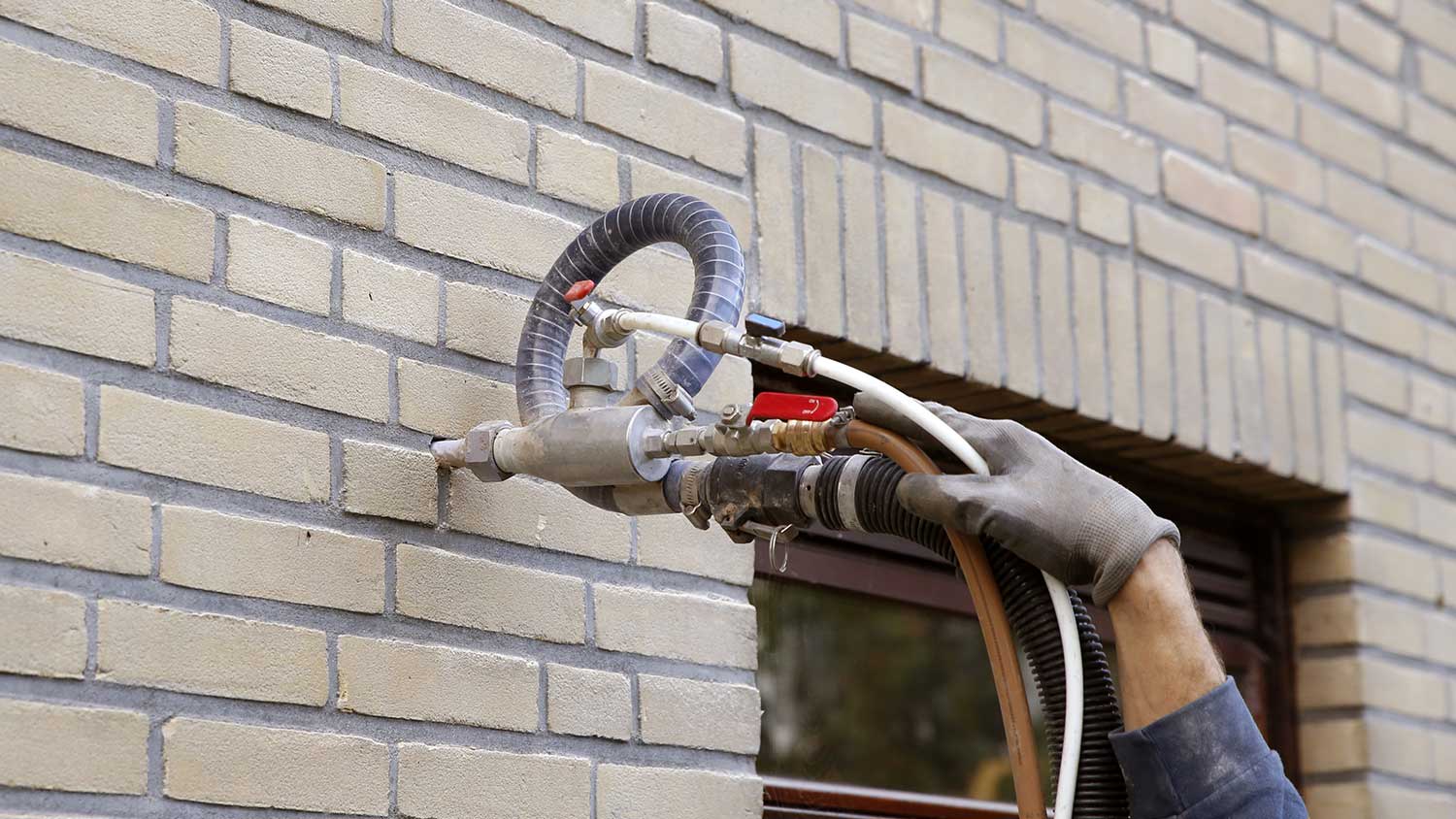 injecting insulation in to a brick wall