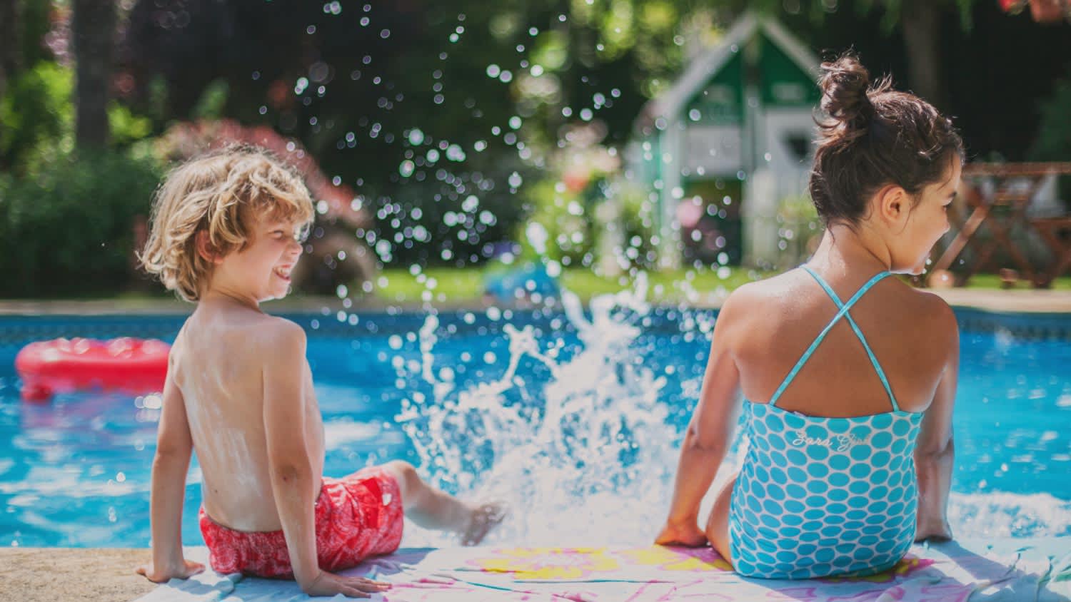 Two kids having fun in pool