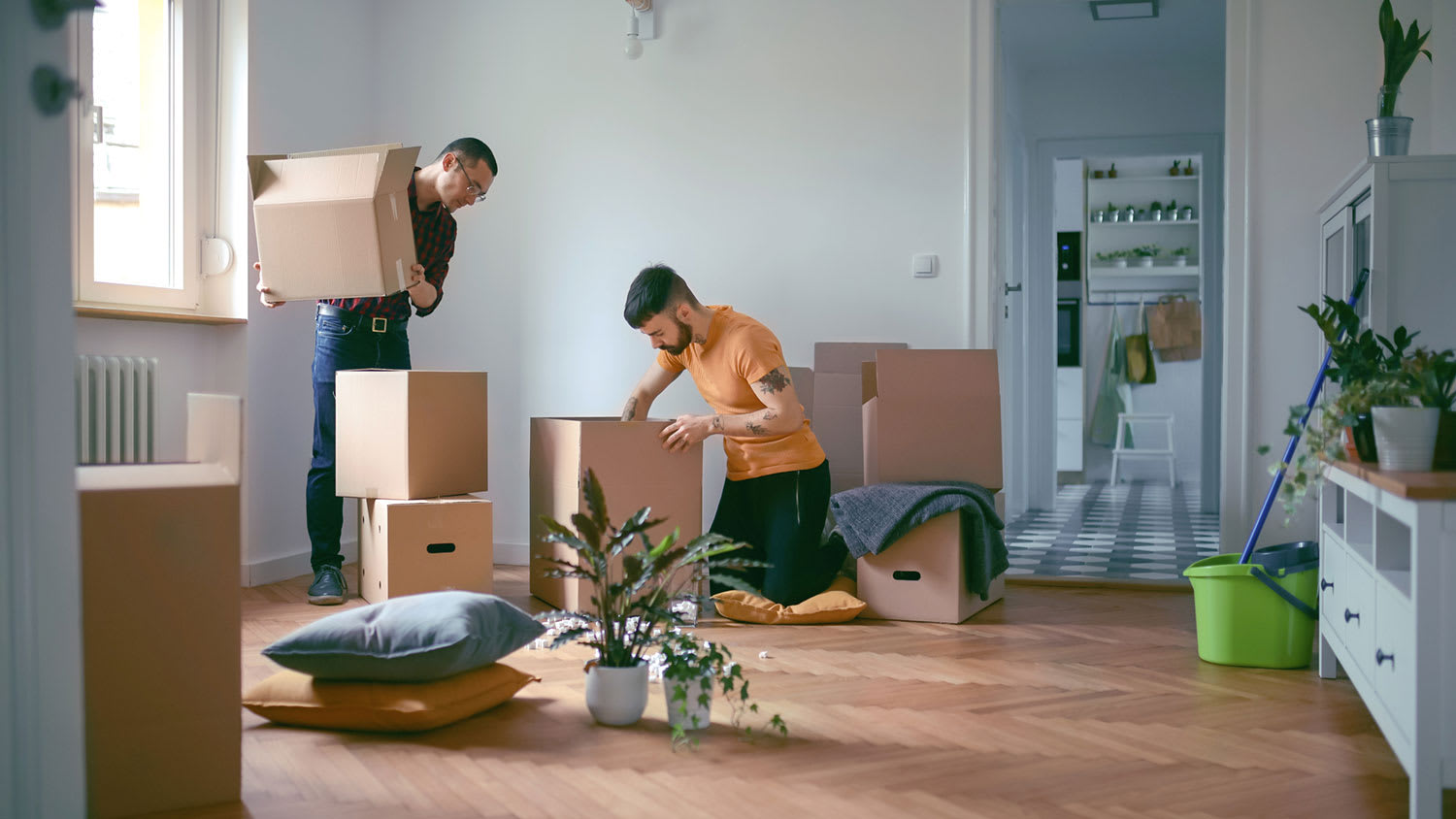 Couple unpacking boxes in a new home