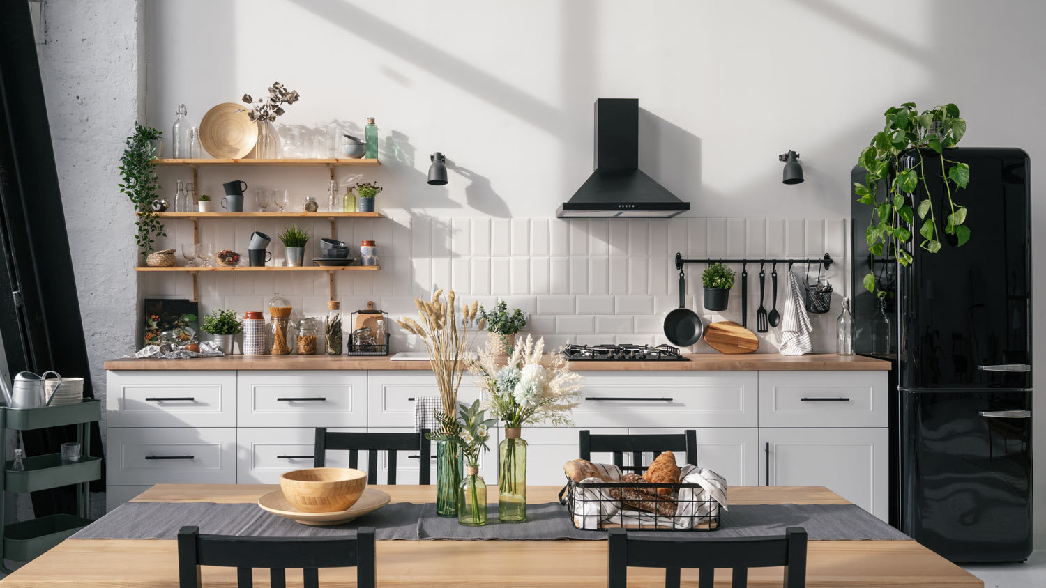 A modern kitchen with a black range hood