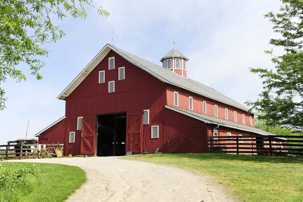 big red barn on a farm