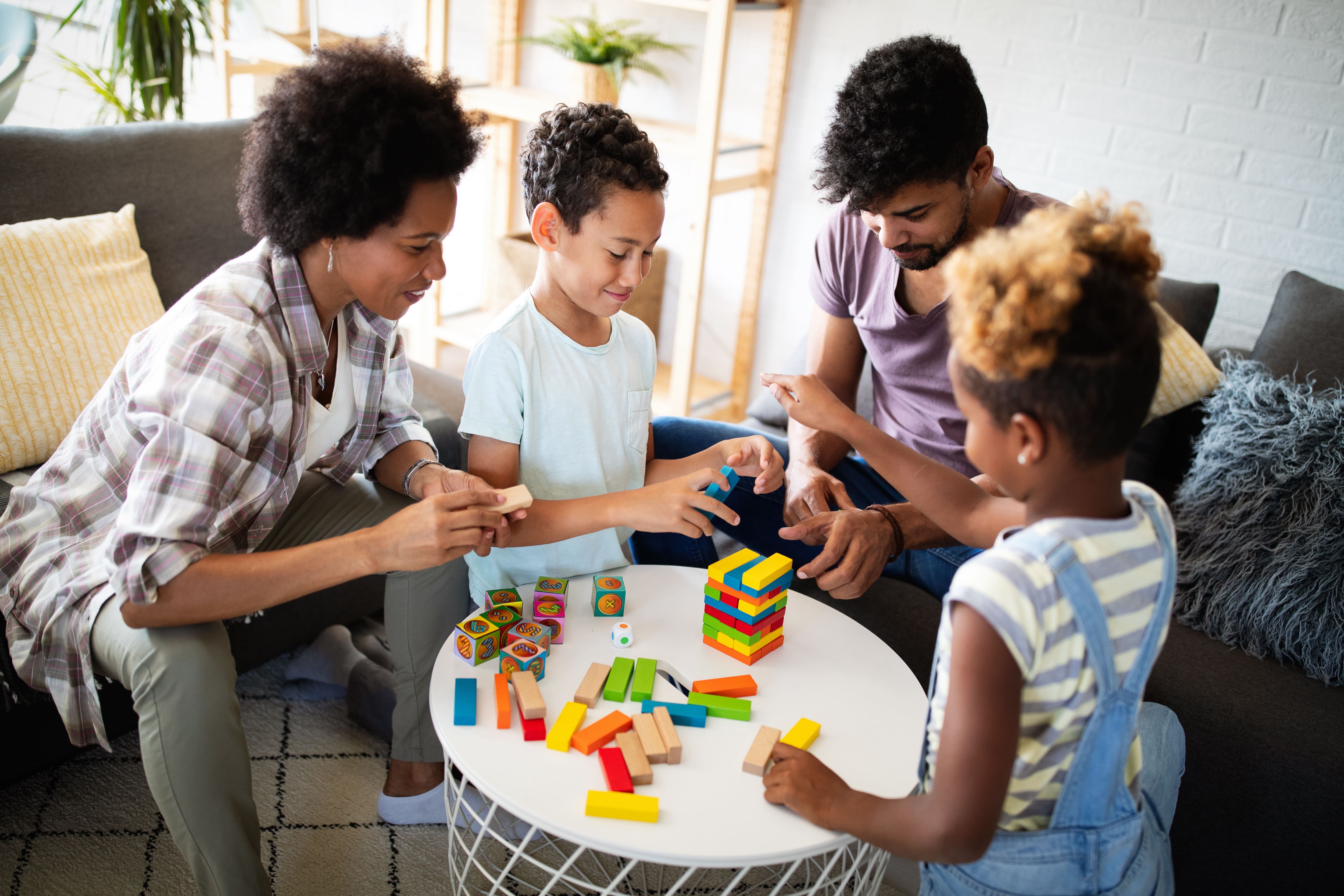 Family playing game on table