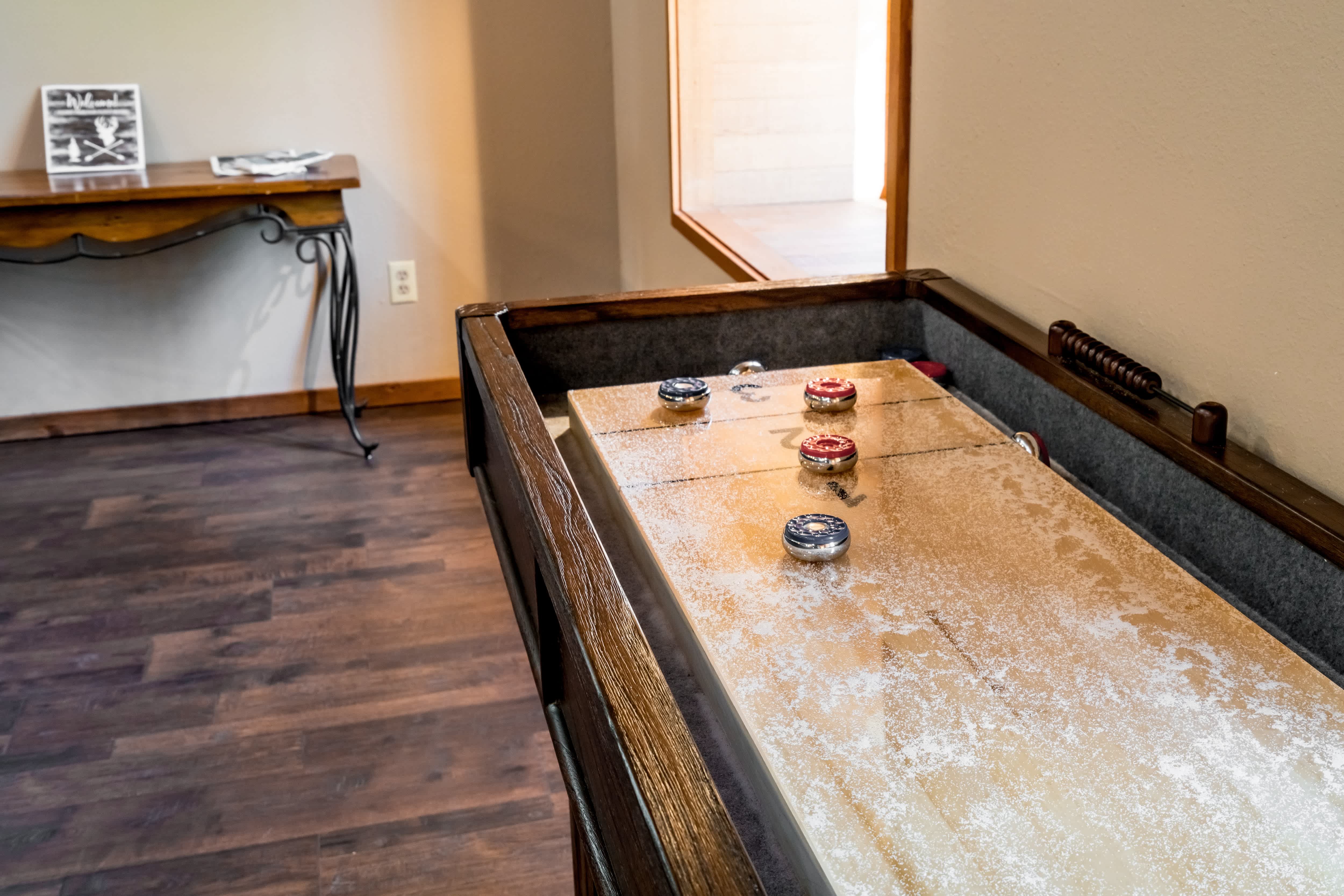 Shuffleboard table in game room