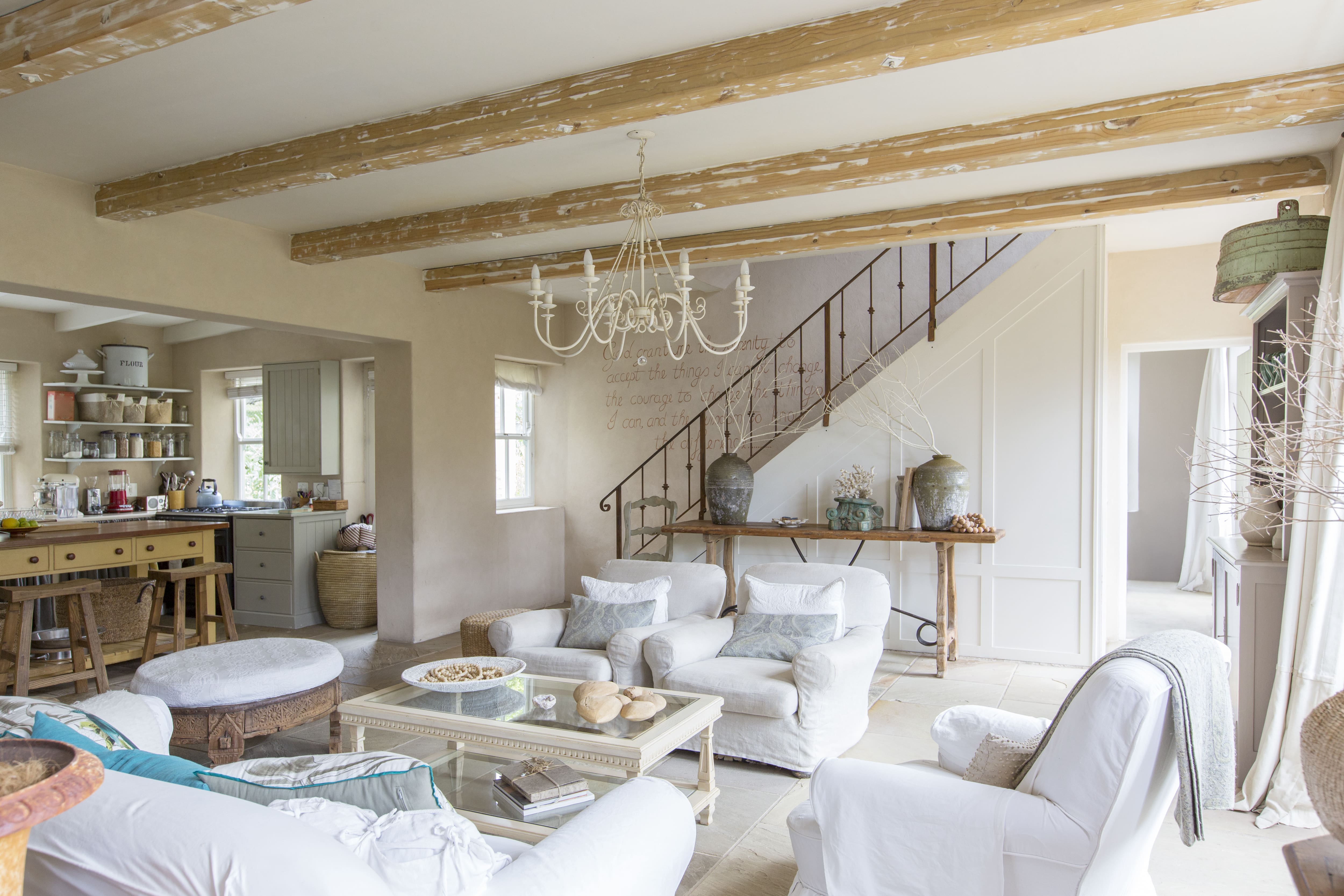 Exposed beams in rustic-style living room
