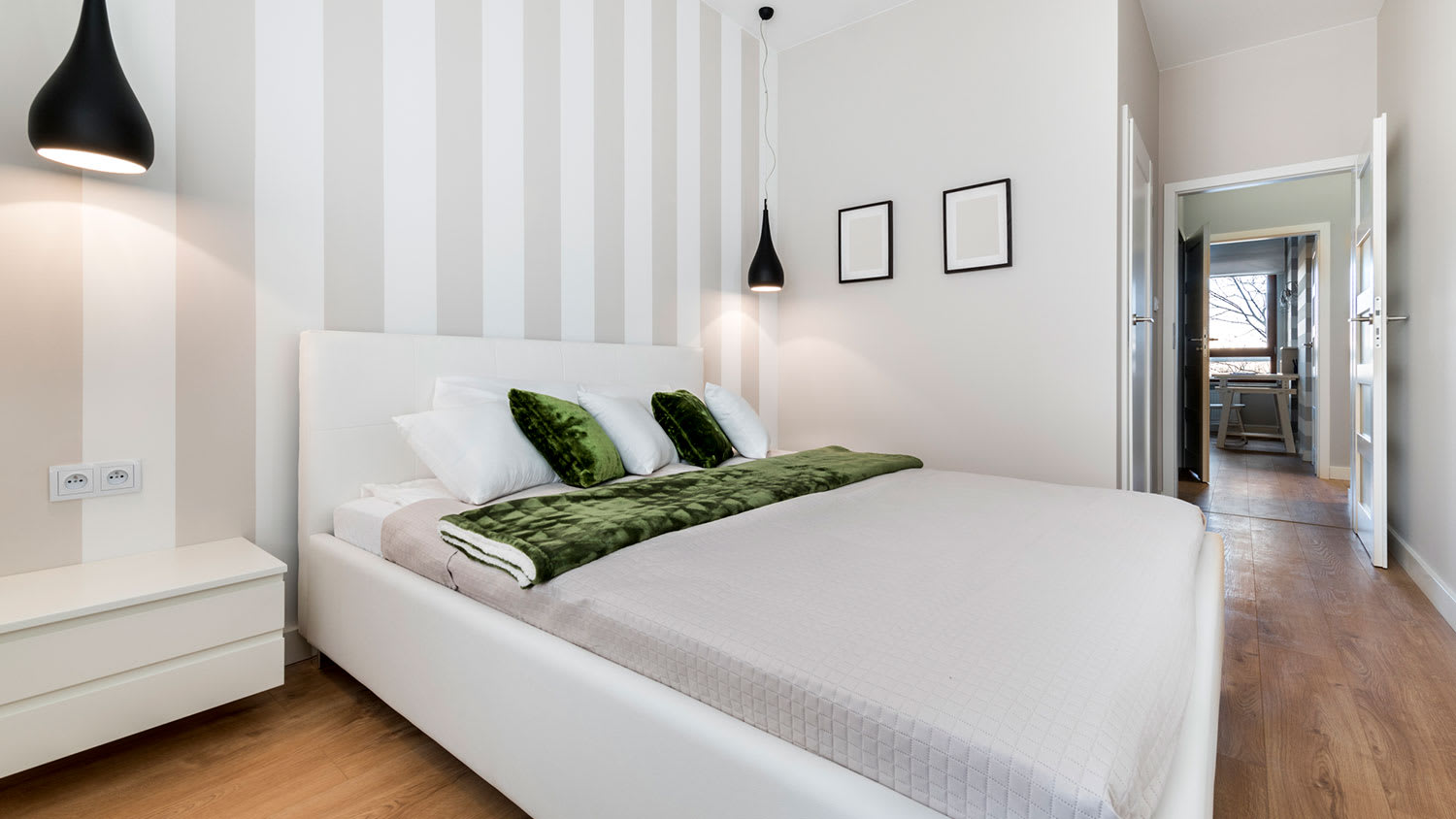 Bedroom with striped accent wall