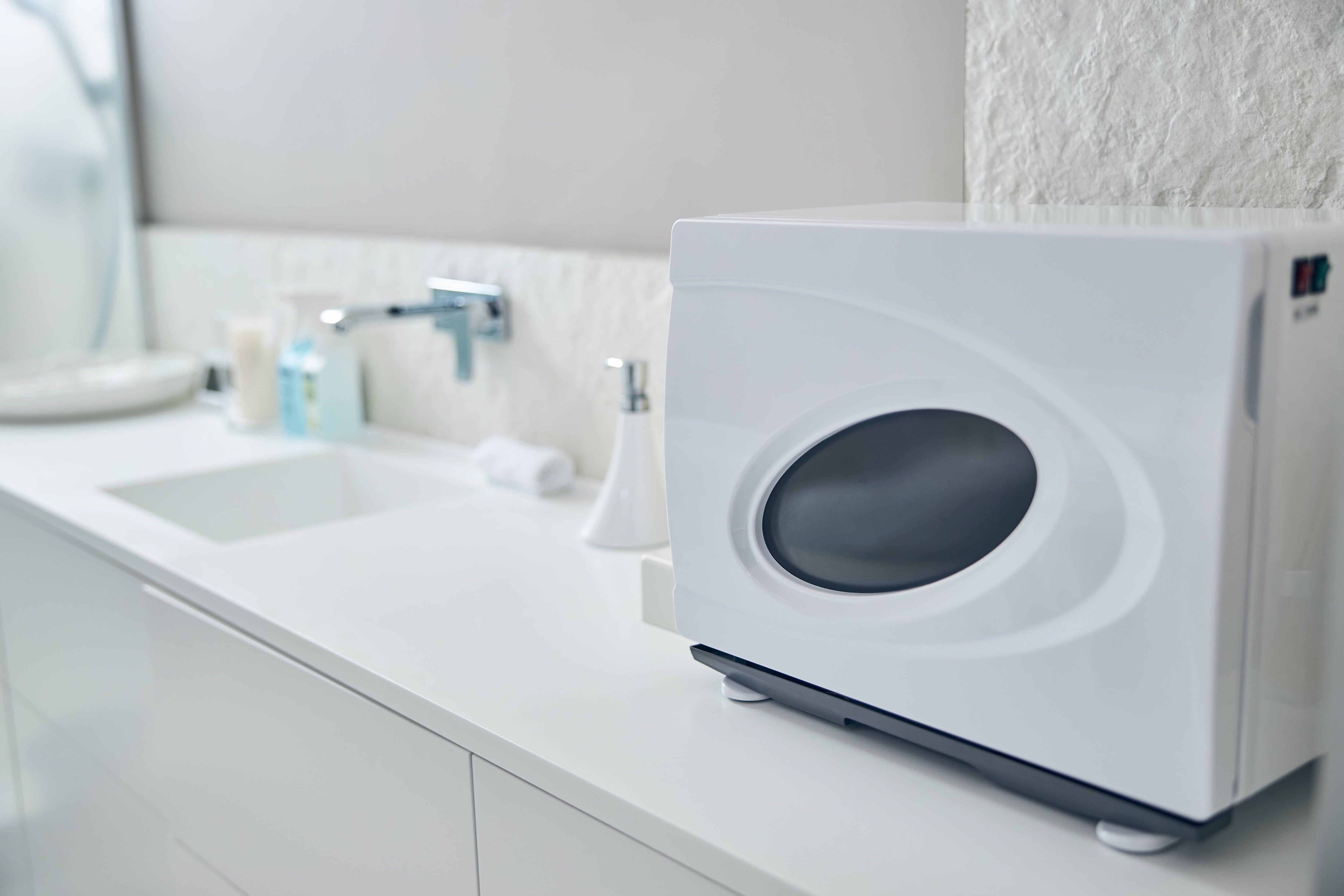Towel warmer on countertop in bathroom
