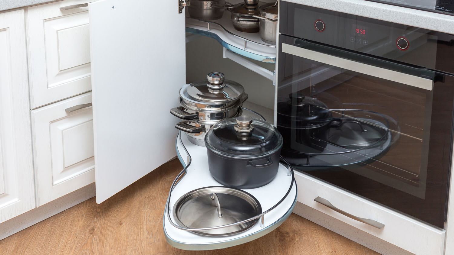 A kitchen corner unit with pullout shelves for cookware