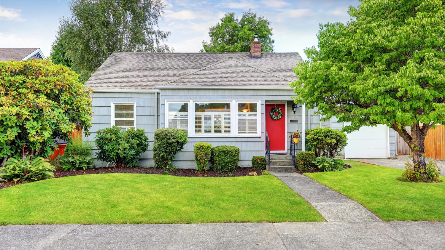 A cozy house with a red front door
