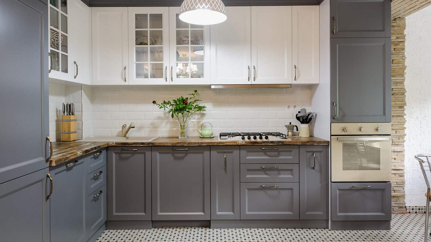 A modern kitchen with white and gray cabinets