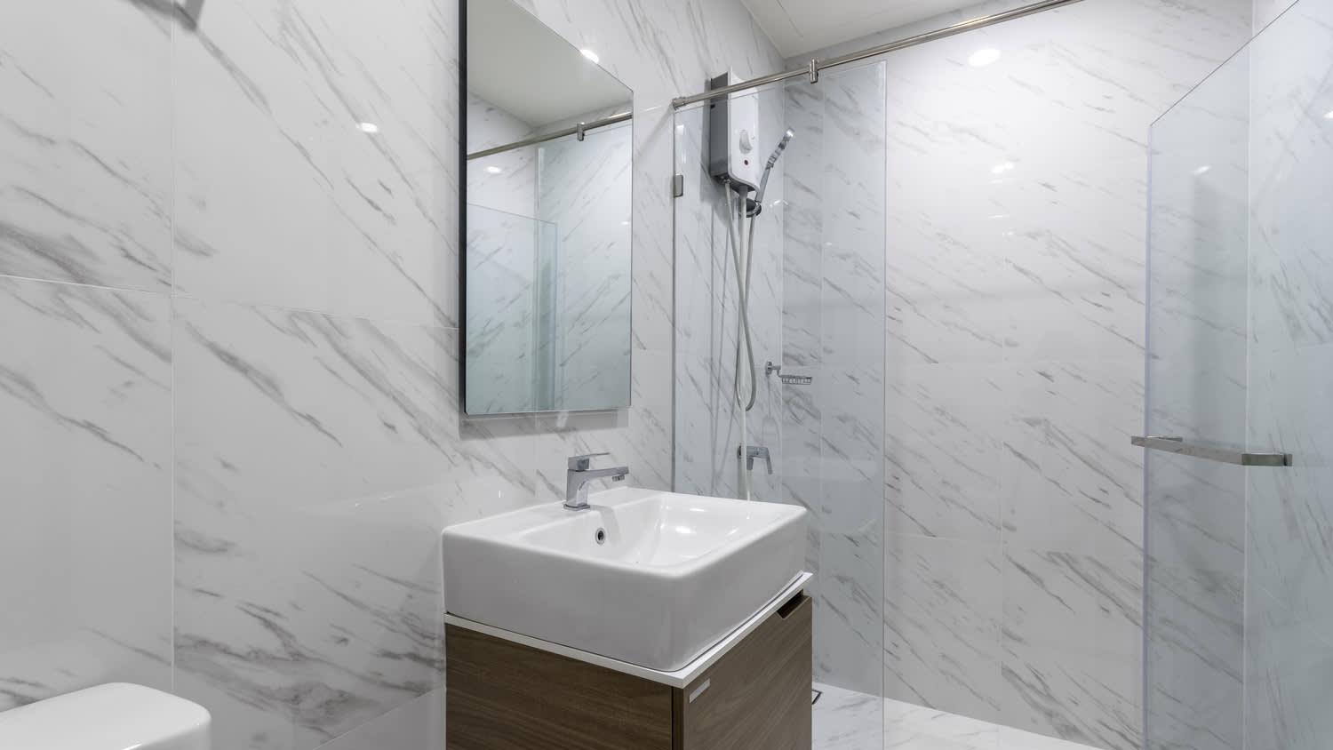 A frameless shower cabin in a modern bathroom