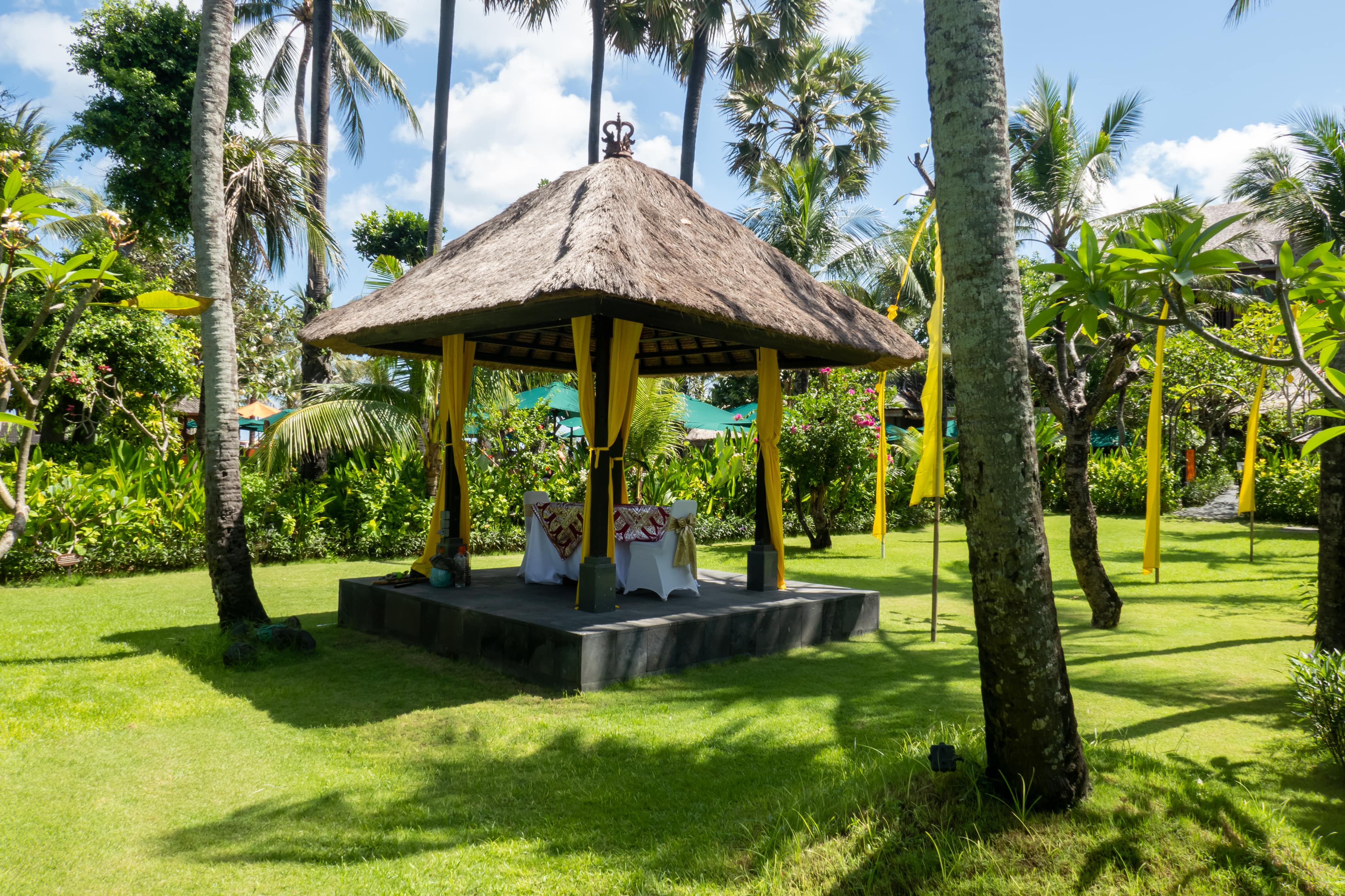 Secluded pergola on a platform with a thatched roof
