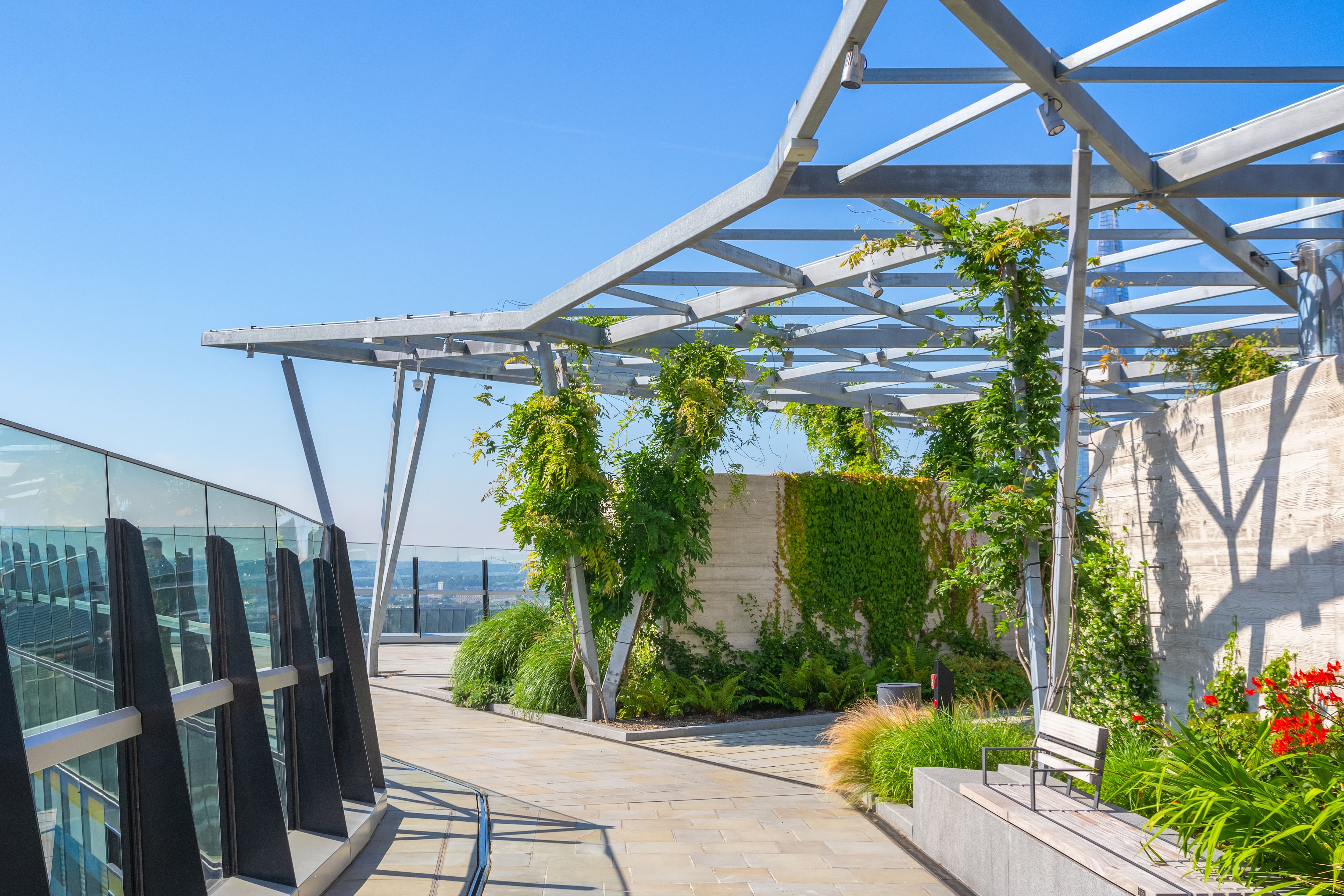 Modern pergola made of metal on top of a building