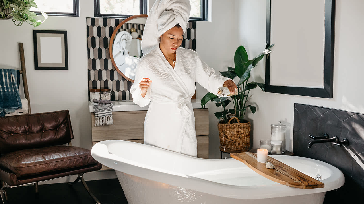 woman preparing a luxurious bath for herself
