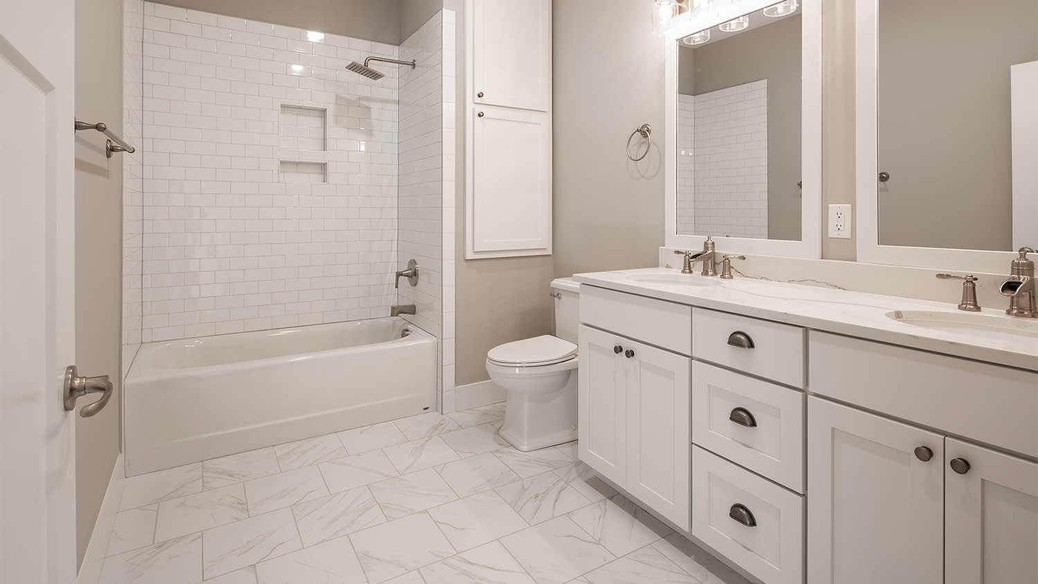 white and beige bathroom with subway tile