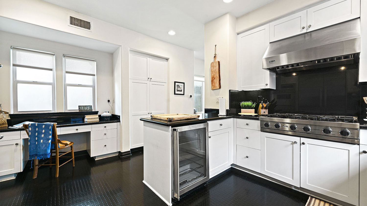 Black floor white cabinet walls kitchen